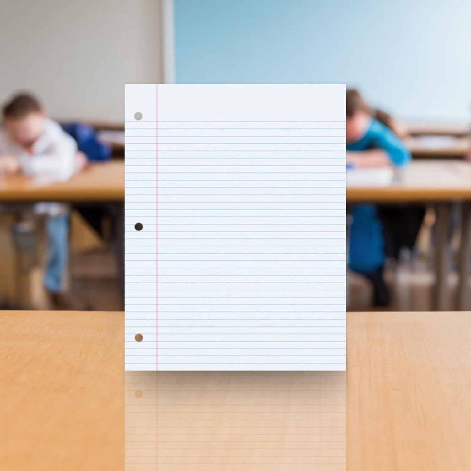 School Smart filler paper on a wooden desk in a classroom setting