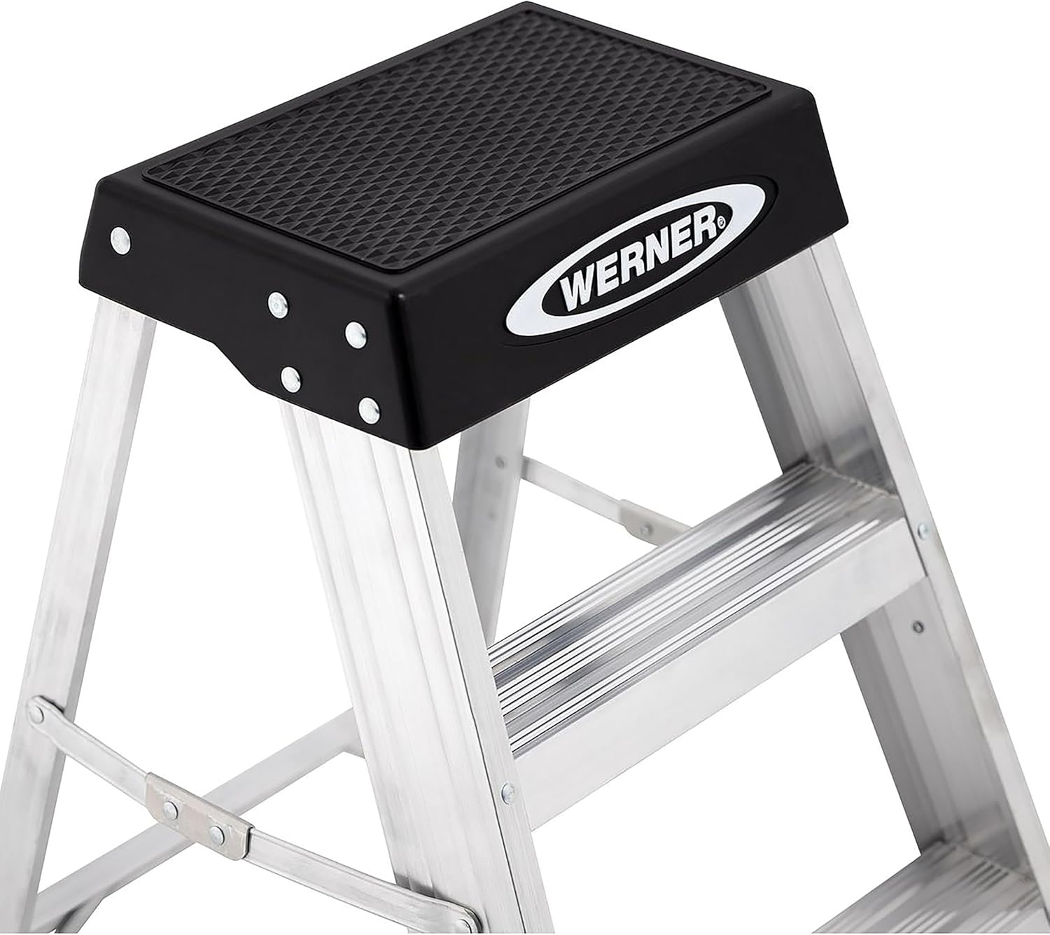 Kati-ake view of the top step of the Werner 150B aluminum step stool, showing the black non-slip tread and the 'WERNER' brand logo.