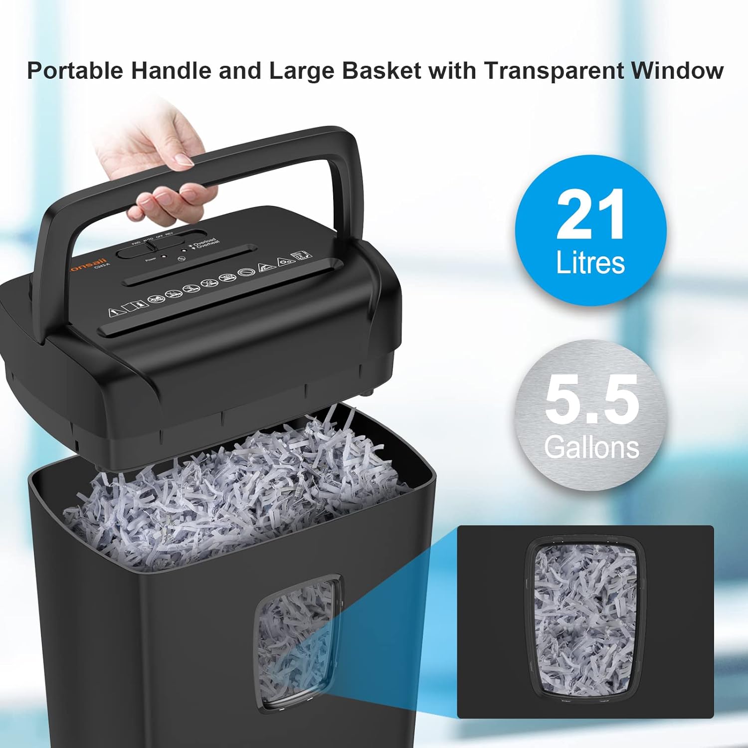 Hand lifting the top unit of the Bonsaii C243-A shredder from its waste bin, showing shredded paper inside