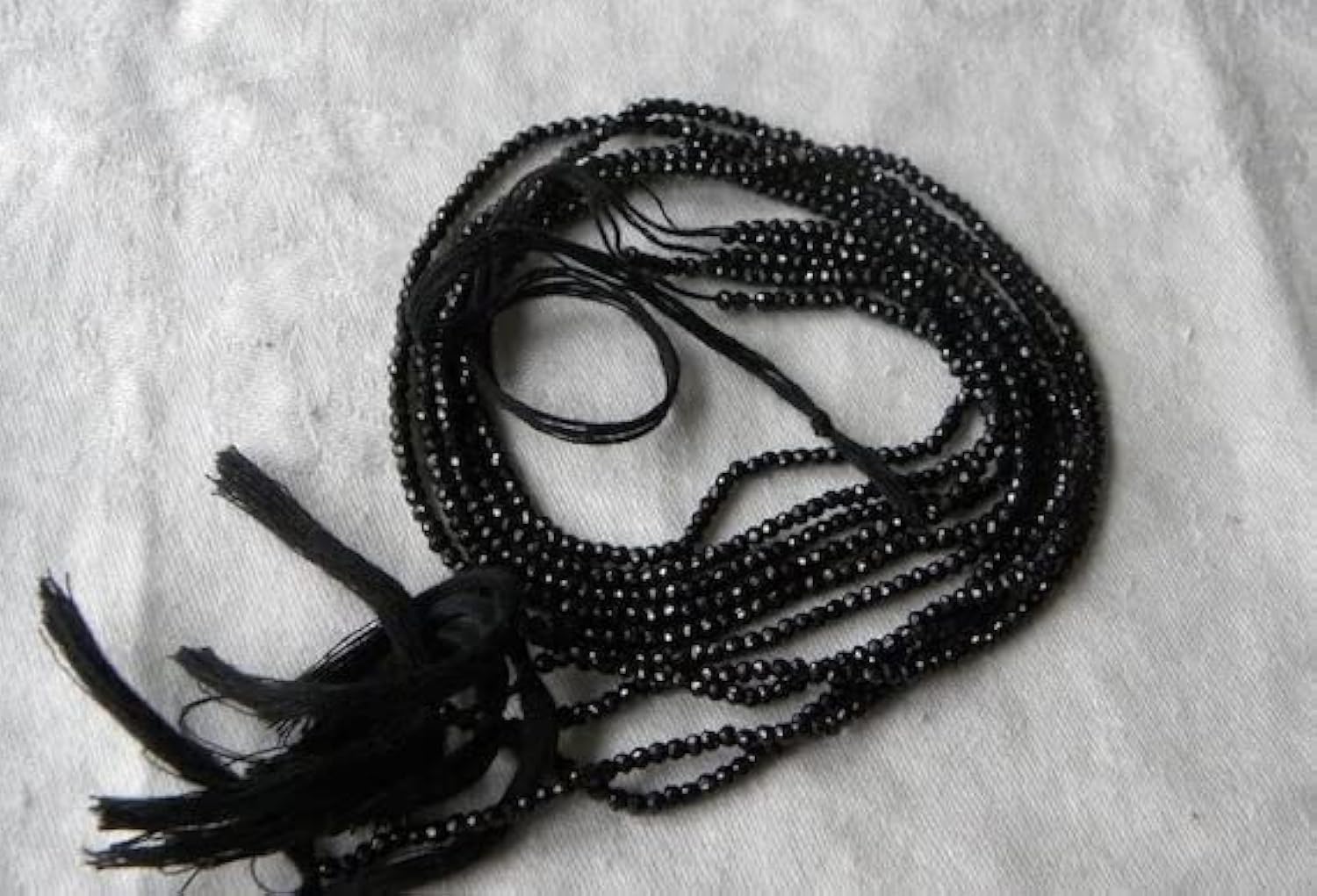 Perles spinelle noire facettées fini brillant pour réparer un collier cassé