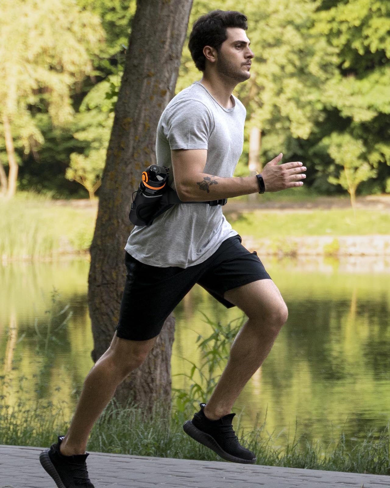 WATERFLY Ceinture pour bouteille d'eau de course : sac banane d'hydratation pour homme et femme avec porte-bouteille pour coureurs, marche, randonnée, jogging, noir, Medium, Support stable pour