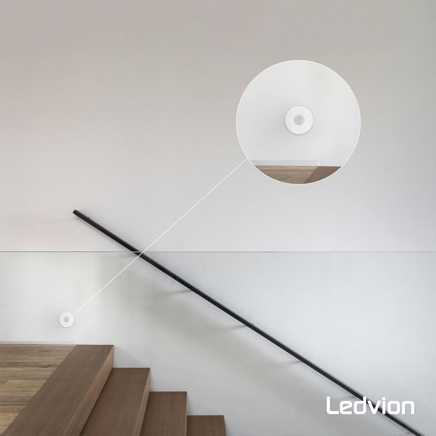 Ledvion Motion Sensor installed on a wall near a staircase