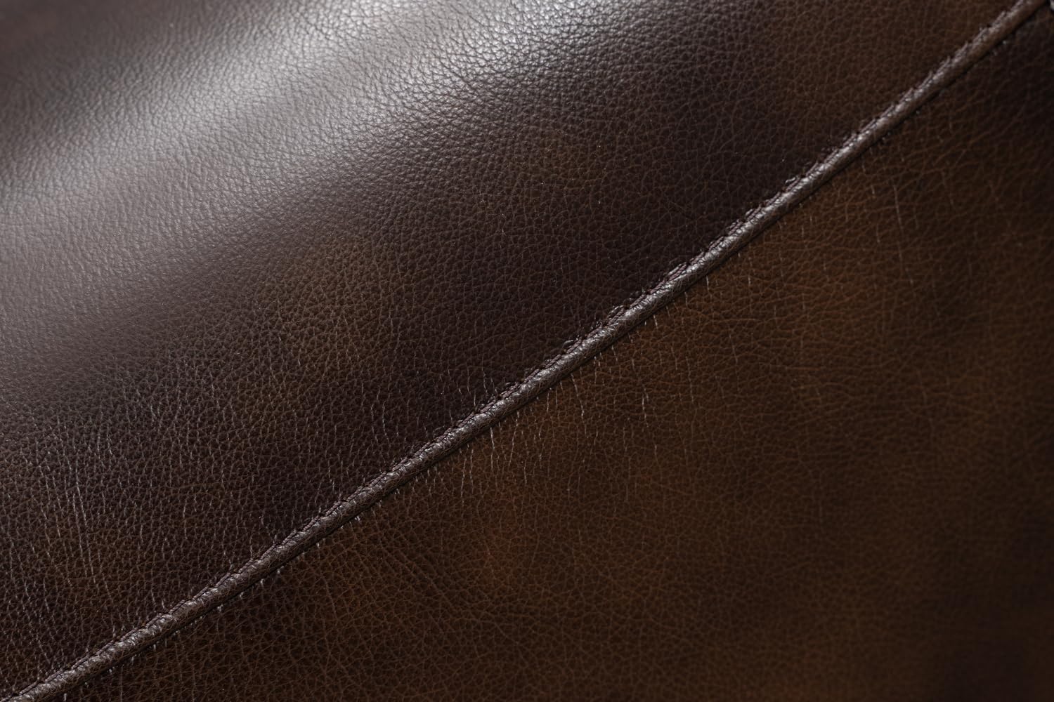 Close-up image showing the texture and stitching of the Tonya Brown leather upholstery.