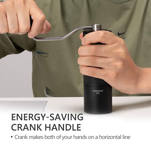 A person gripping the TIMEMORE C2S grinder body and turning the fixed steel crank handle, with both hands level