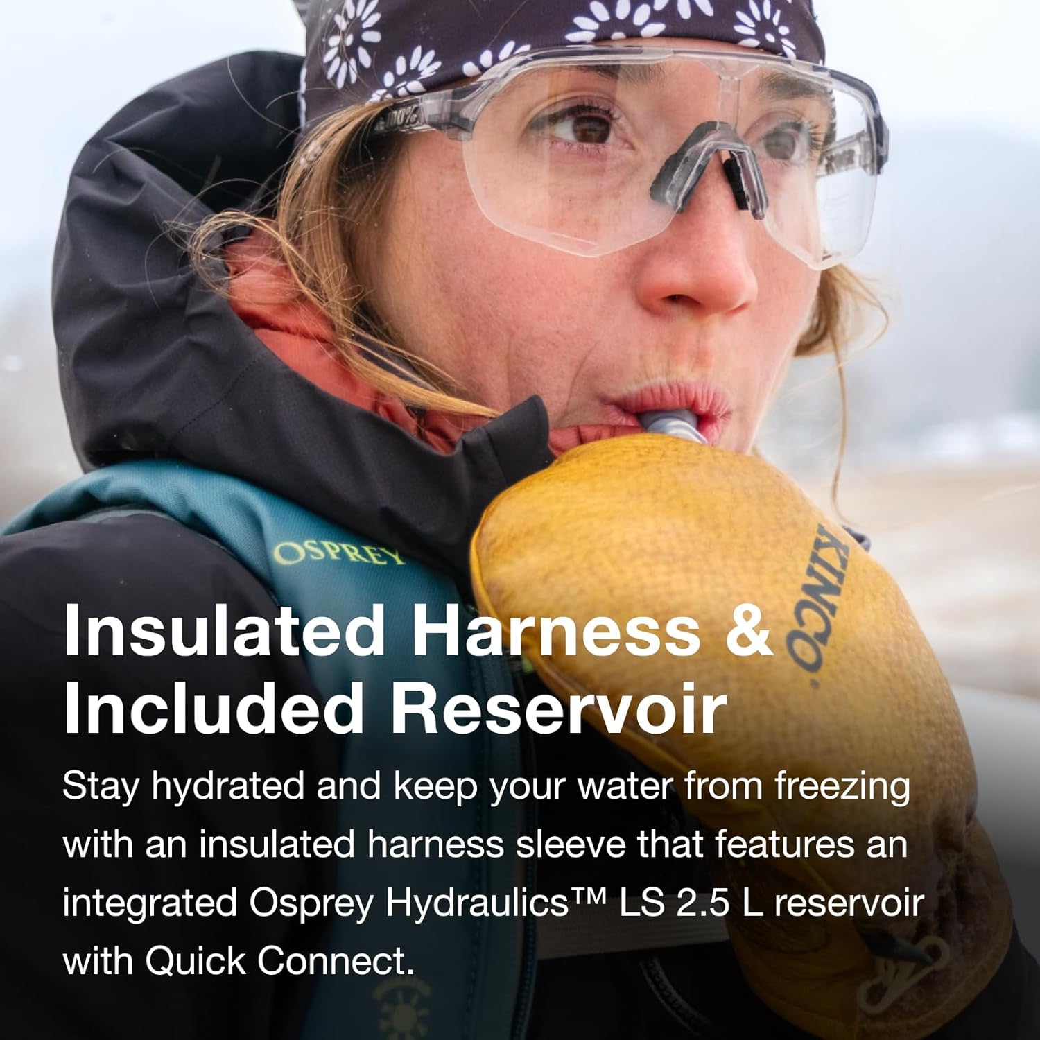 Person drinking from the insulated hydration hose of the Osprey Glade backpack