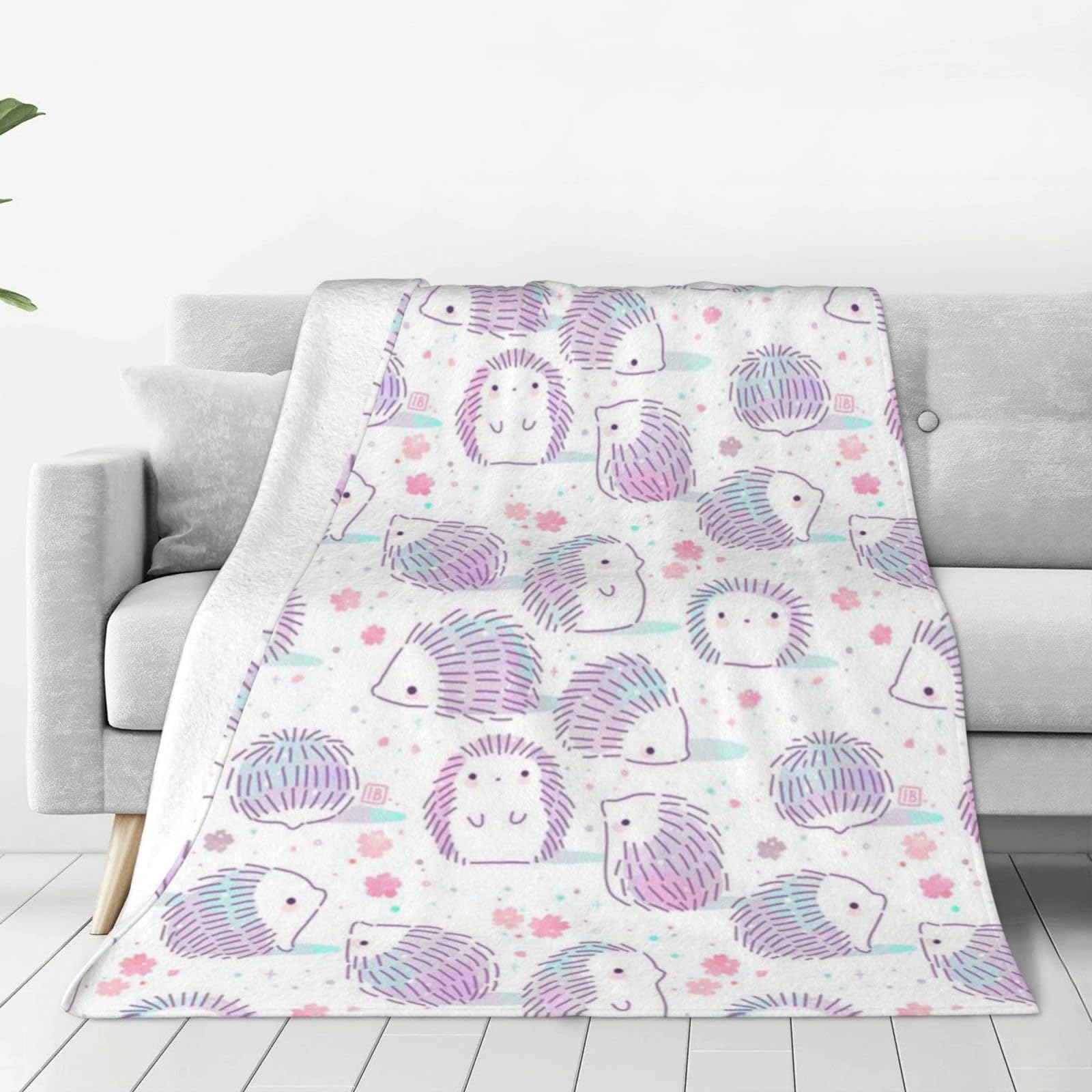Couverture polaire rose motif hérisson idéale pour vos soirées d'automne cocooning