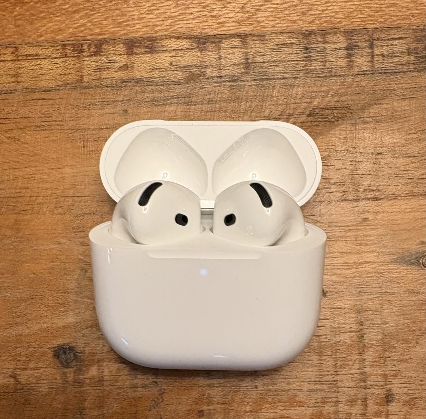 AirPods 4 open case with earbuds inside