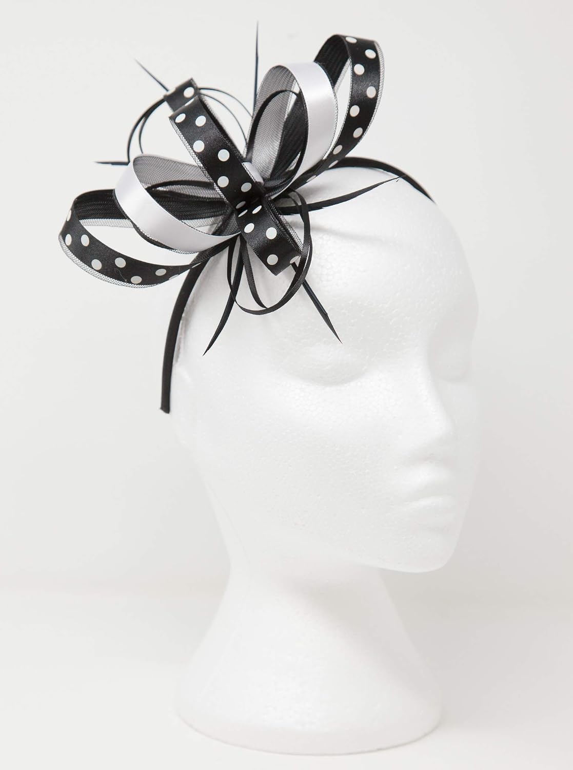 Black and white polka dot fascinator on 