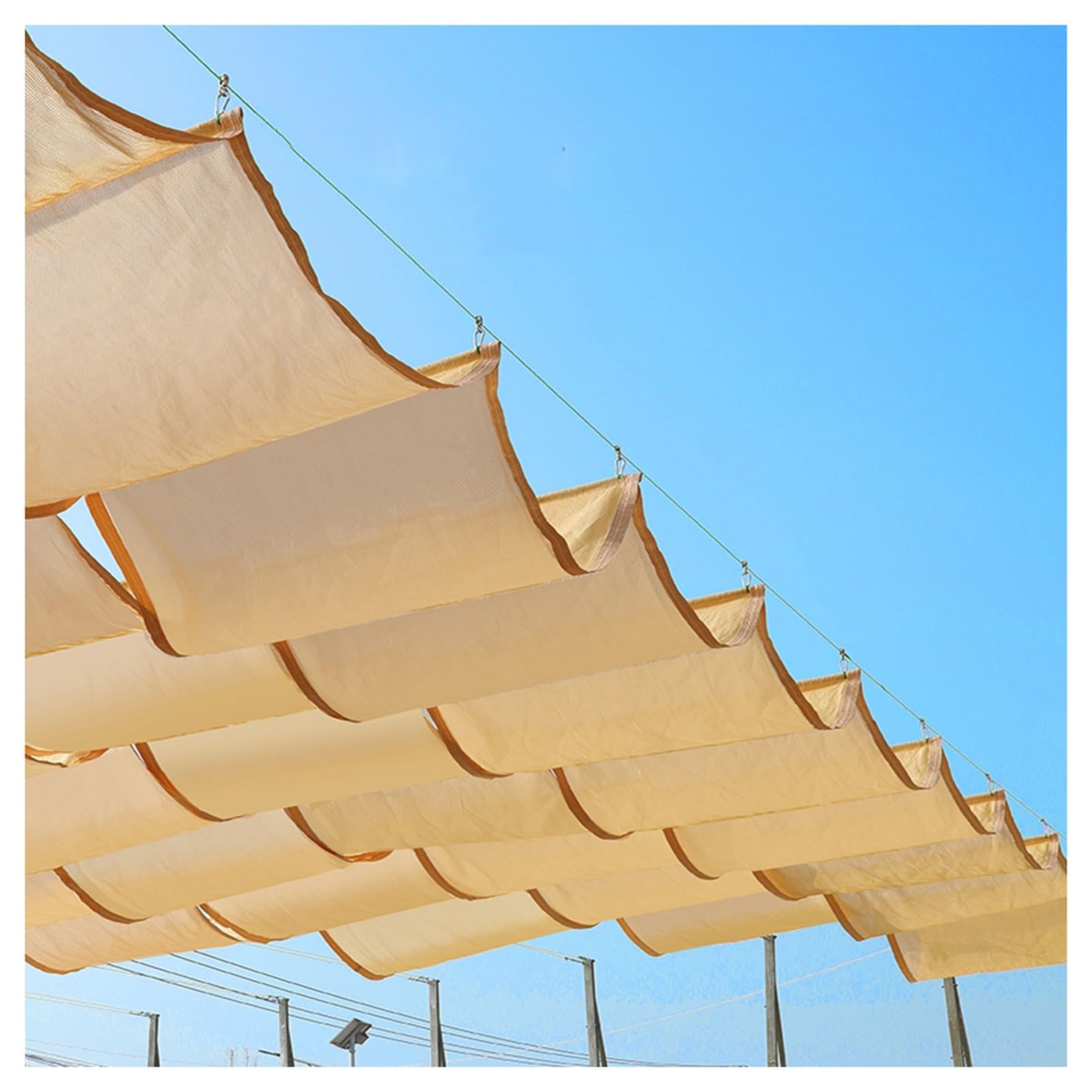Pergola surchauffée ? Voile d'ombrage ondulée en U rétractable et étanche