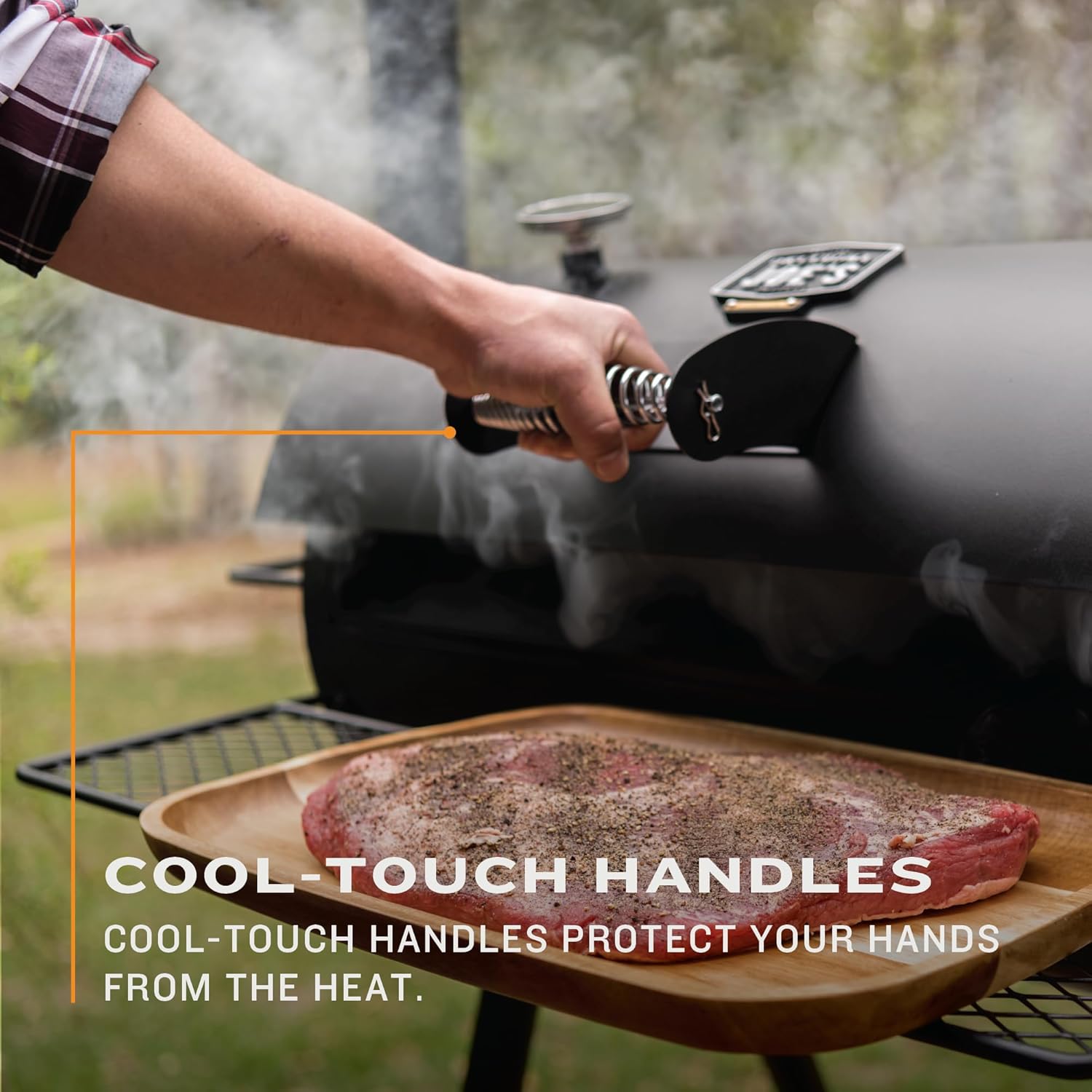 Close-up view of the porcelain-coated wire cooking grates inside the smoker