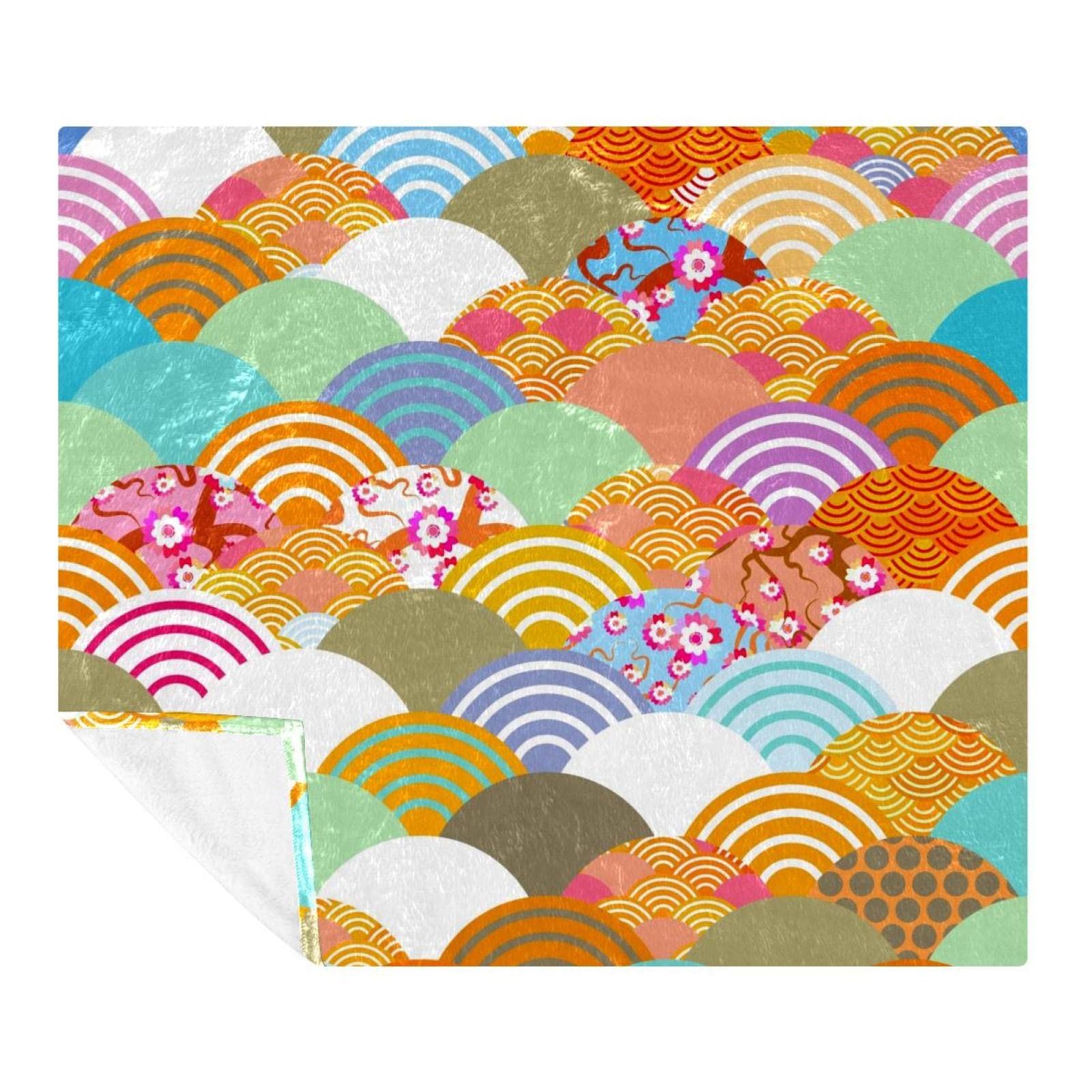 Couverture douce cerise rose pour cocooning sur le canapé