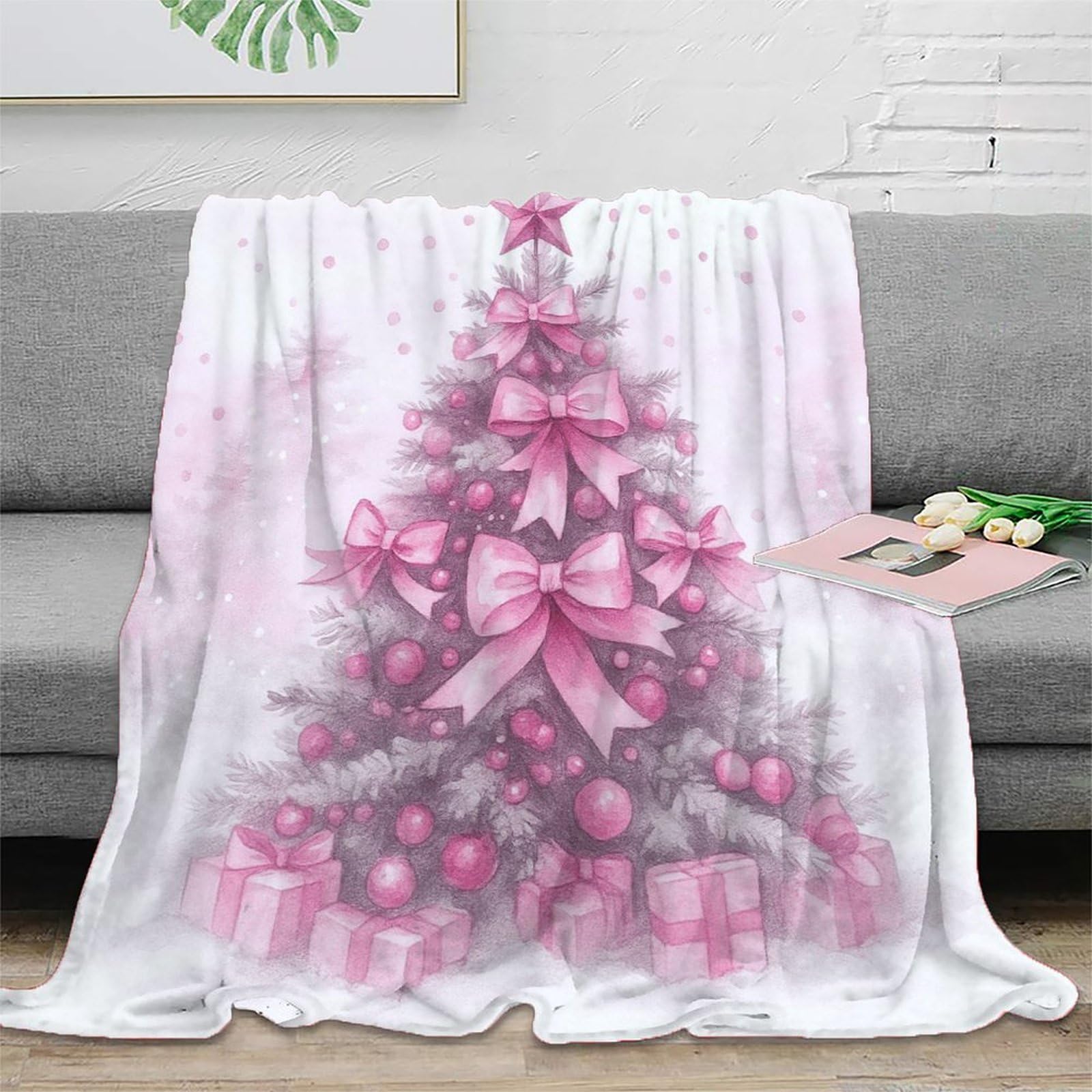 Couverture Noël rose en microfibre pour des soirées cocooning en couple au salon