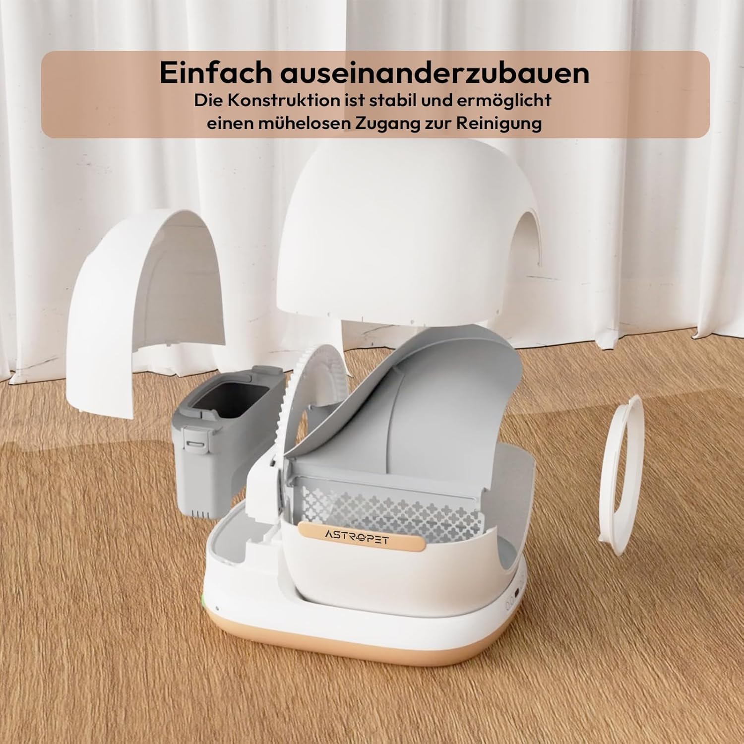 A explodat view of the AstroPet self-cleaning litter tray showing its main components disassembled for cleaning or assembly.