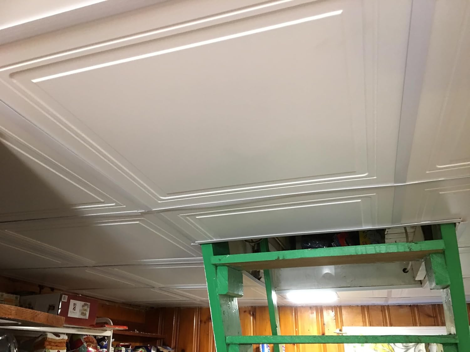 Close-up of installed ceiling tiles in the grid