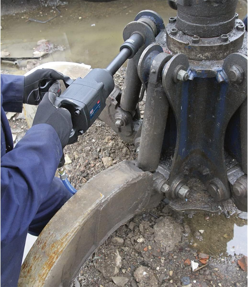 User operating Sealey SA686 Air Impact Wrench on heavy machinery