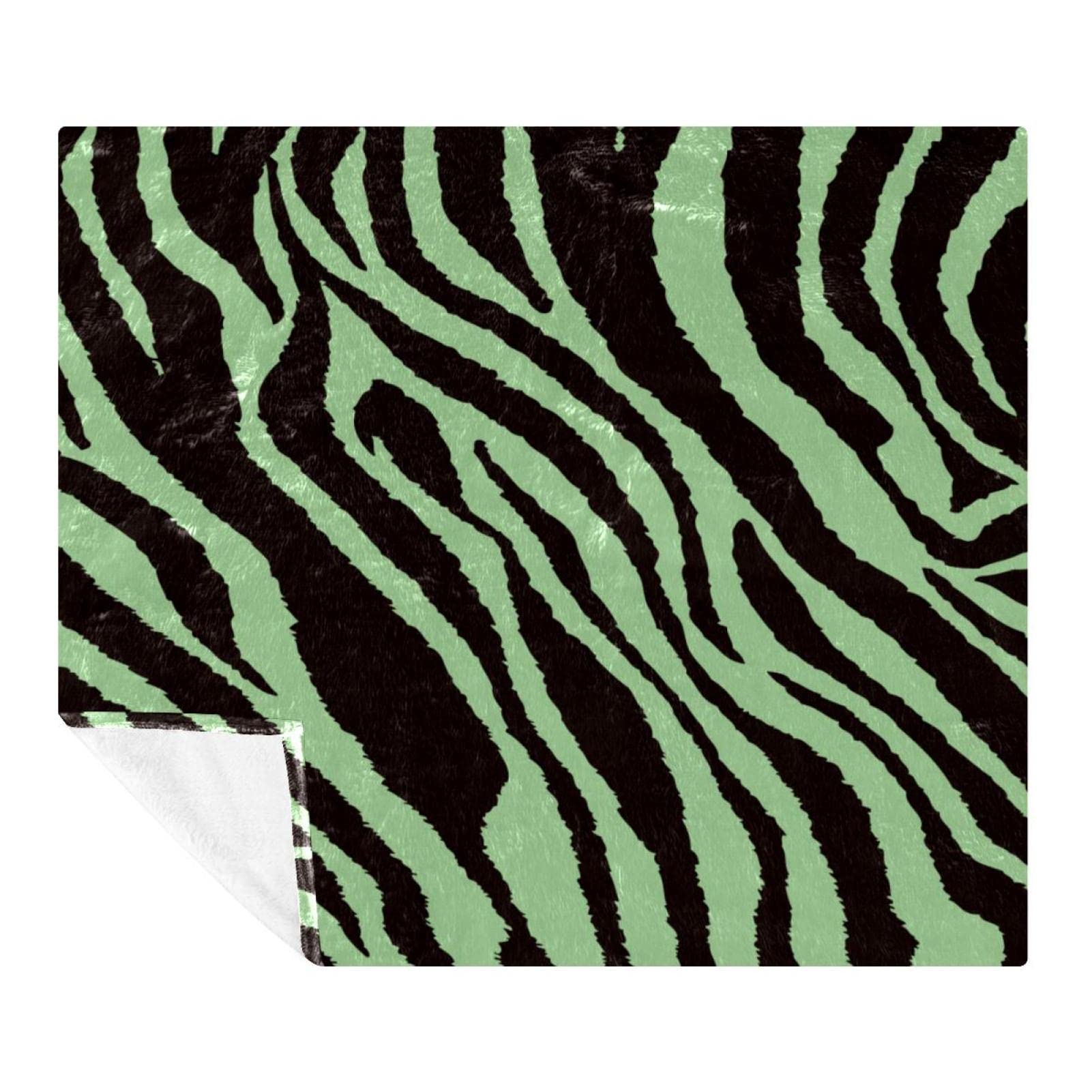 Couverture polaire zèbre idéale pour cocooner sur le canapé