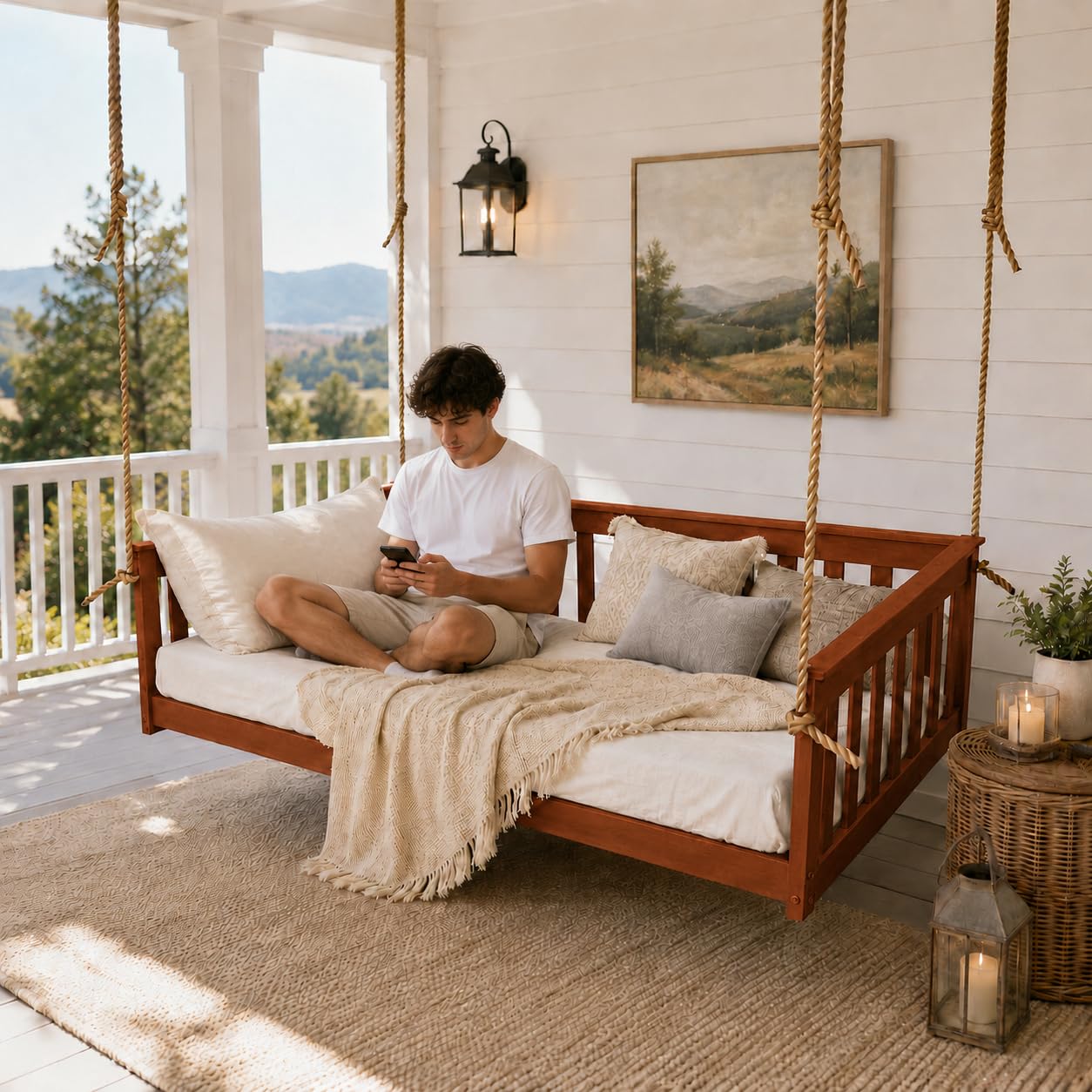 Wooden hanging daybed swing with ivory cushions on a sunlit porch