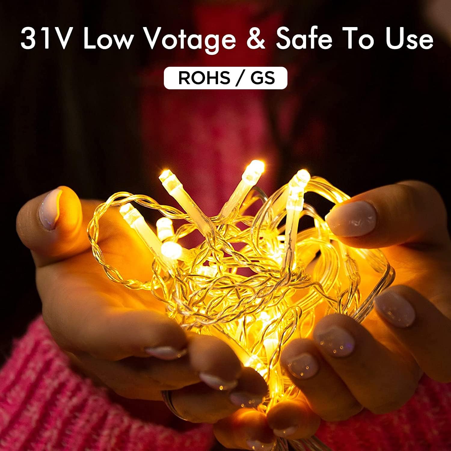 Hands holding a bundle of Quntis LED icicle lights, highlighting their 31V low voltage and safety certifications (ROHS/GS).