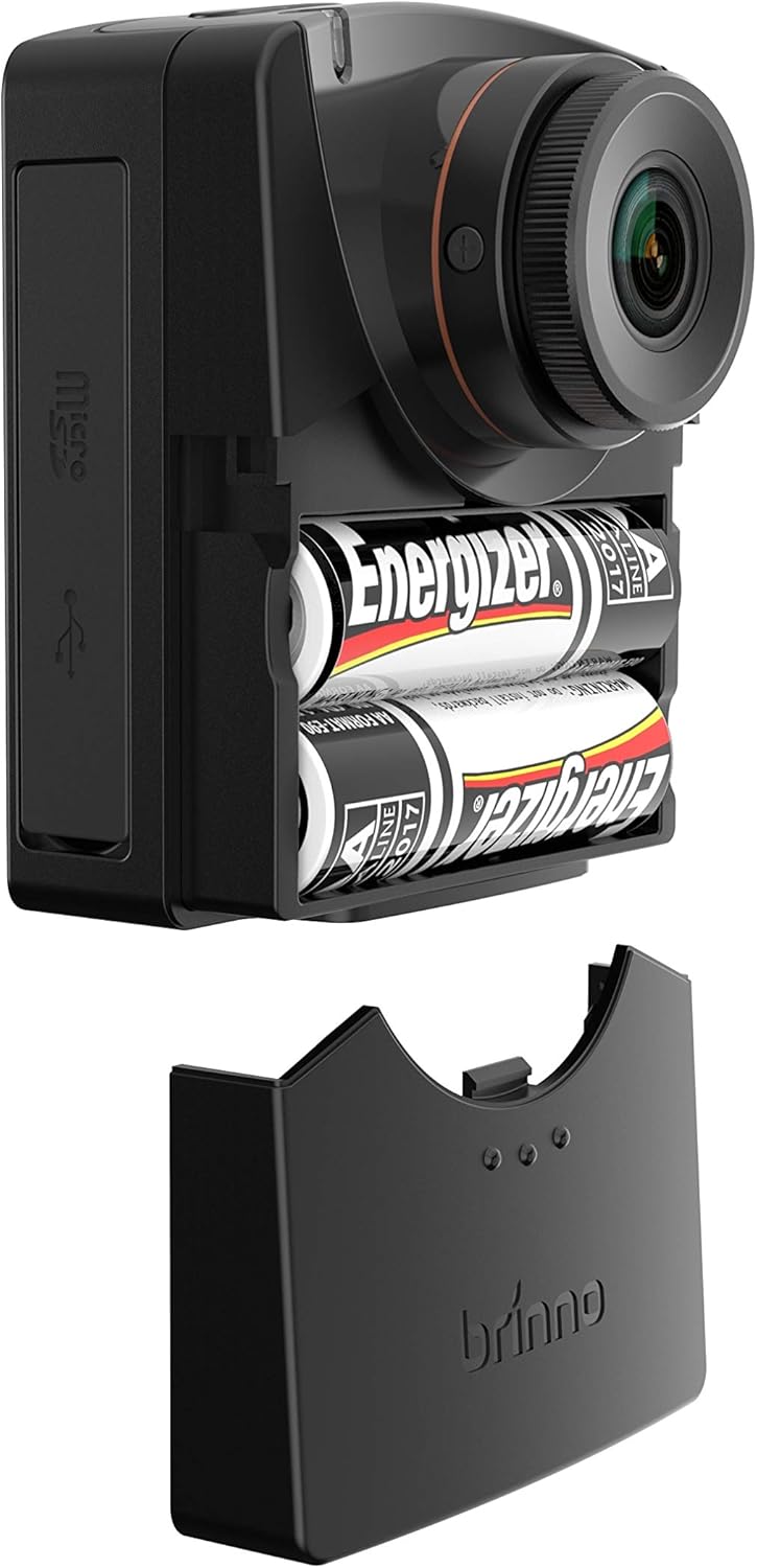 Brinno TLC2000 camera with the battery compartment open, showing two AA batteries inside.