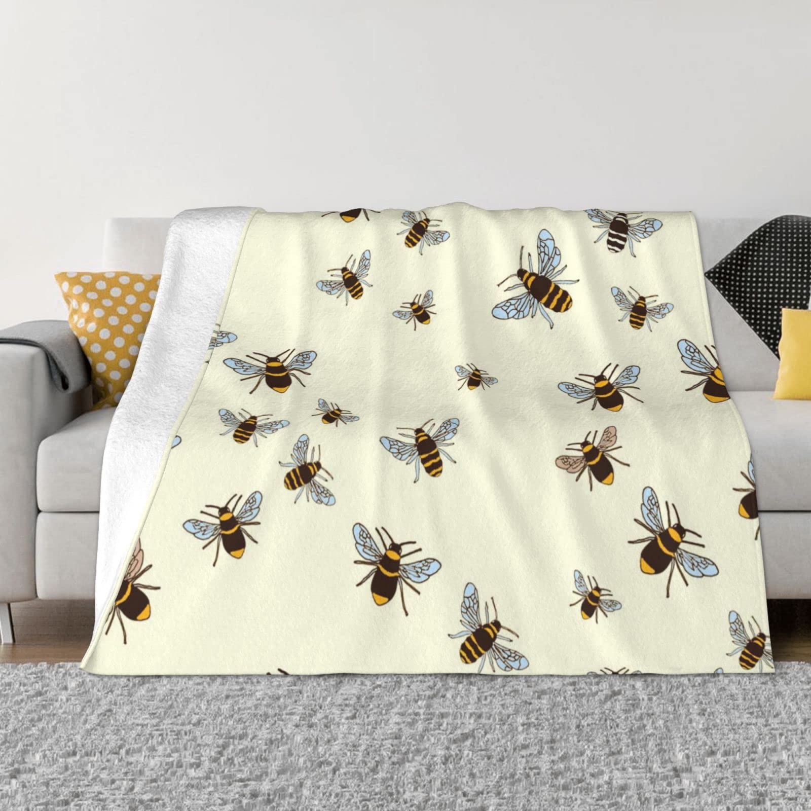 Couverture flanelle polaire abeille pour vos soirées cocooning au salon
