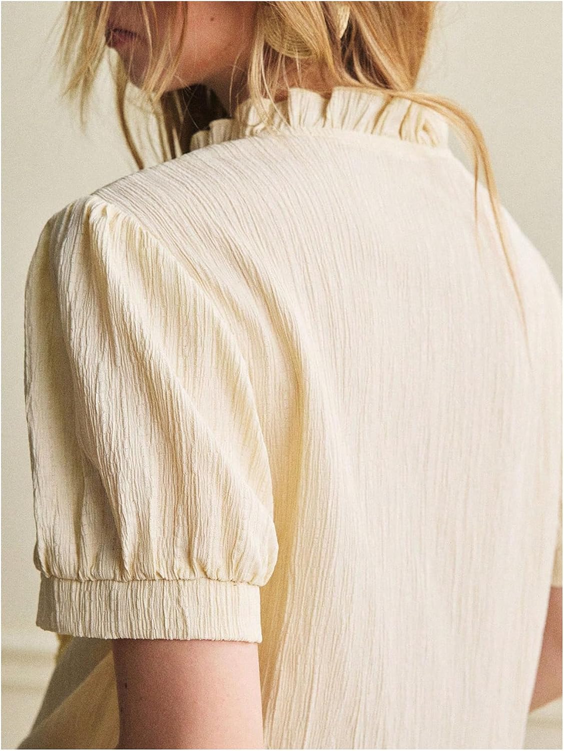 OYOANGLE Women's Puff Sleeve Pearl Button Down Blouses Ruffle Mock Neck Asymmetrical Blouse