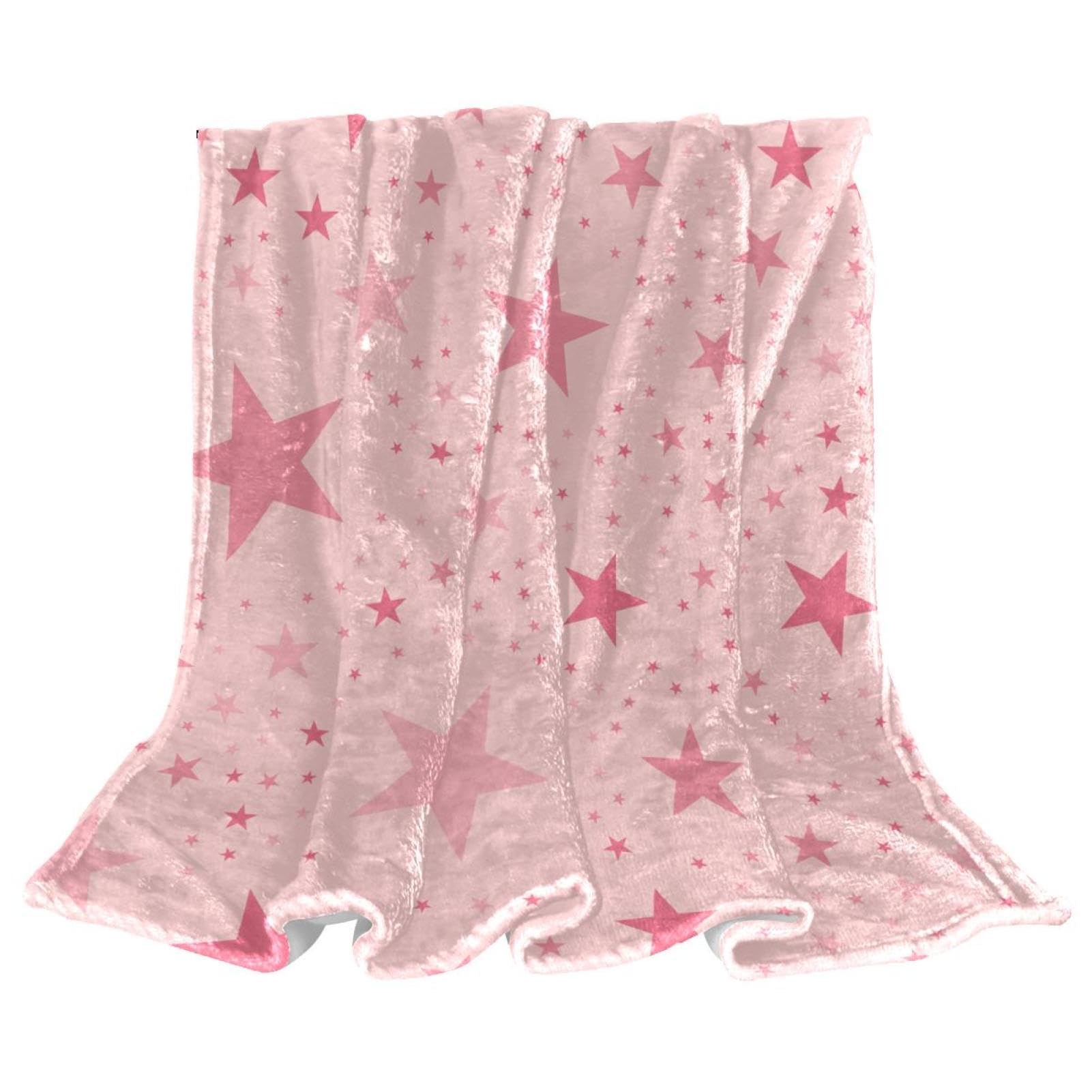 Couverture polaire étoiles roses : le jeté de canapé idéal pour vos soirées cocooning