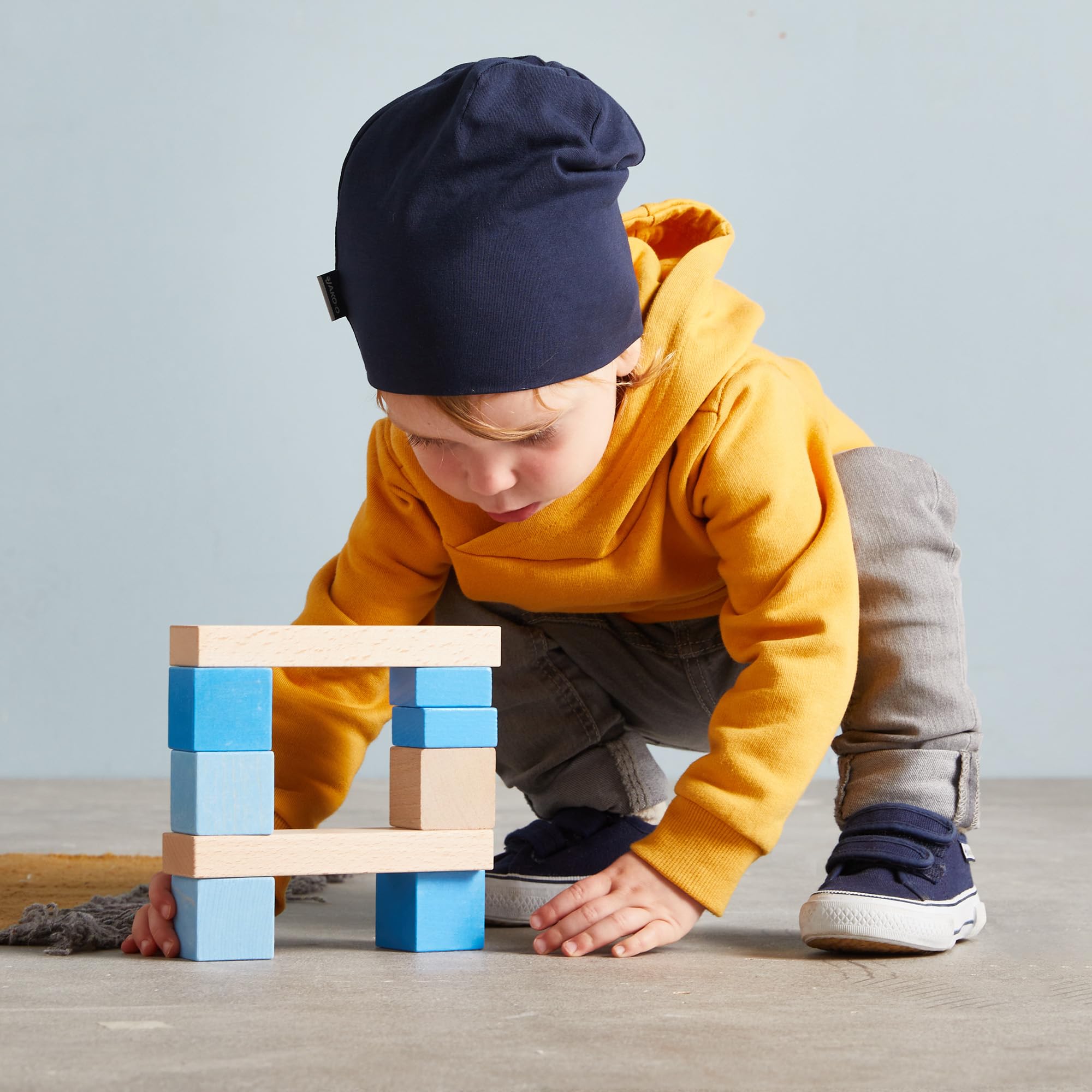 HABA Mis Primeros Bloques de construcción – 46 Bloques de Madera de Colores con Bolsa de algodón – Fabricado en Alemania – para niños a Partir de 1 año – Promueve la motricidad Fina – 2010877001