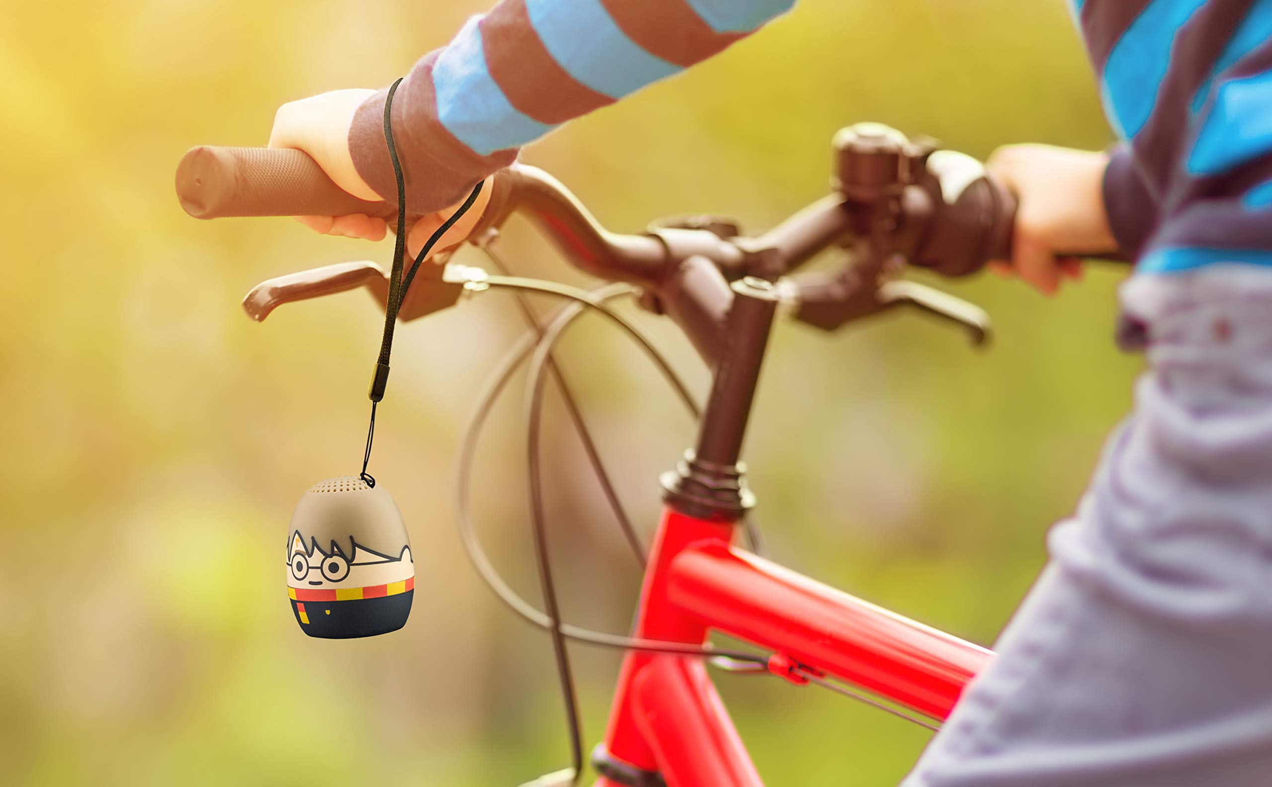 Harry Potter Bluetooth Speaker attached to a bicycle handlebar