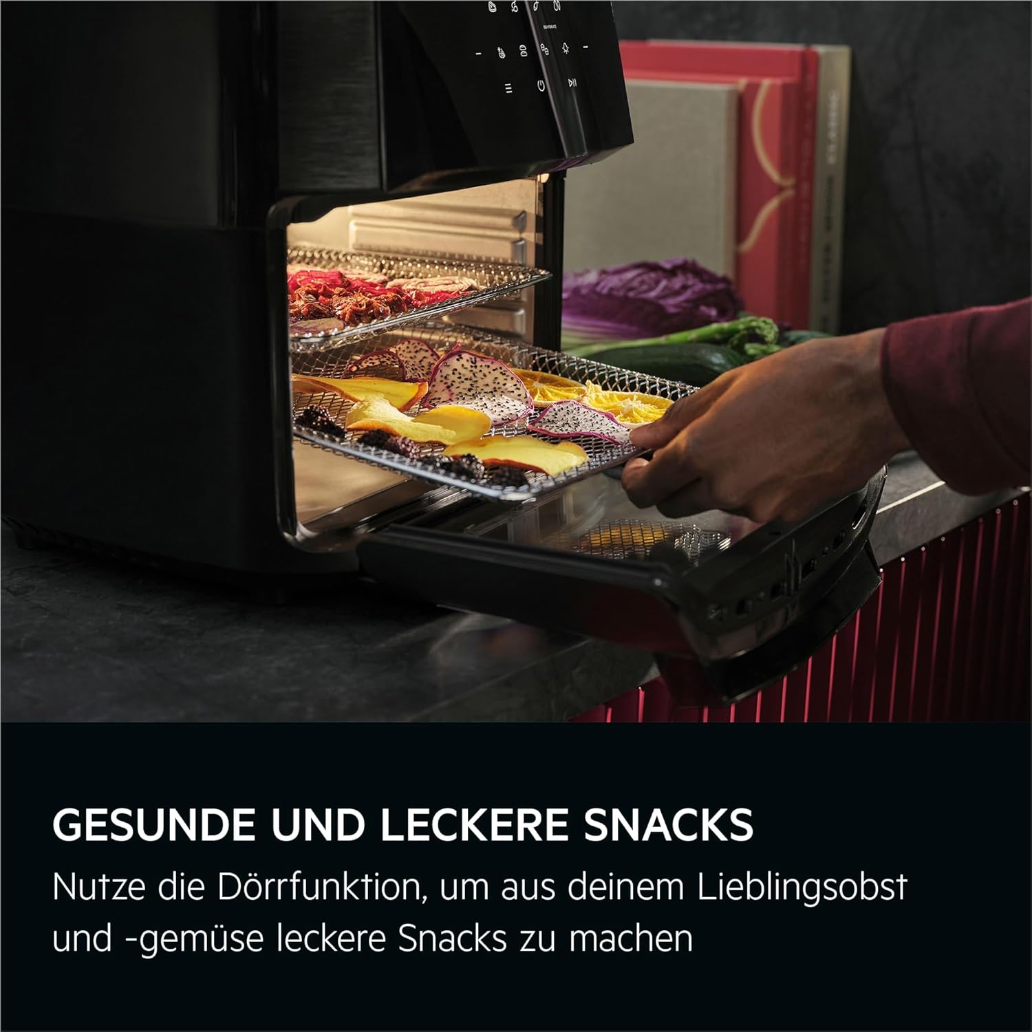 Dried fruit slices on a rack inside the air fryer, demonstrating the dehydration function