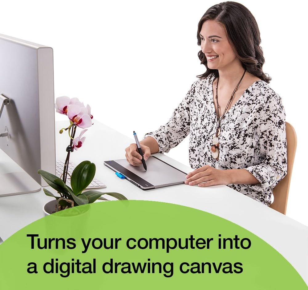 Person using Wacom Intuos tablet with a computer