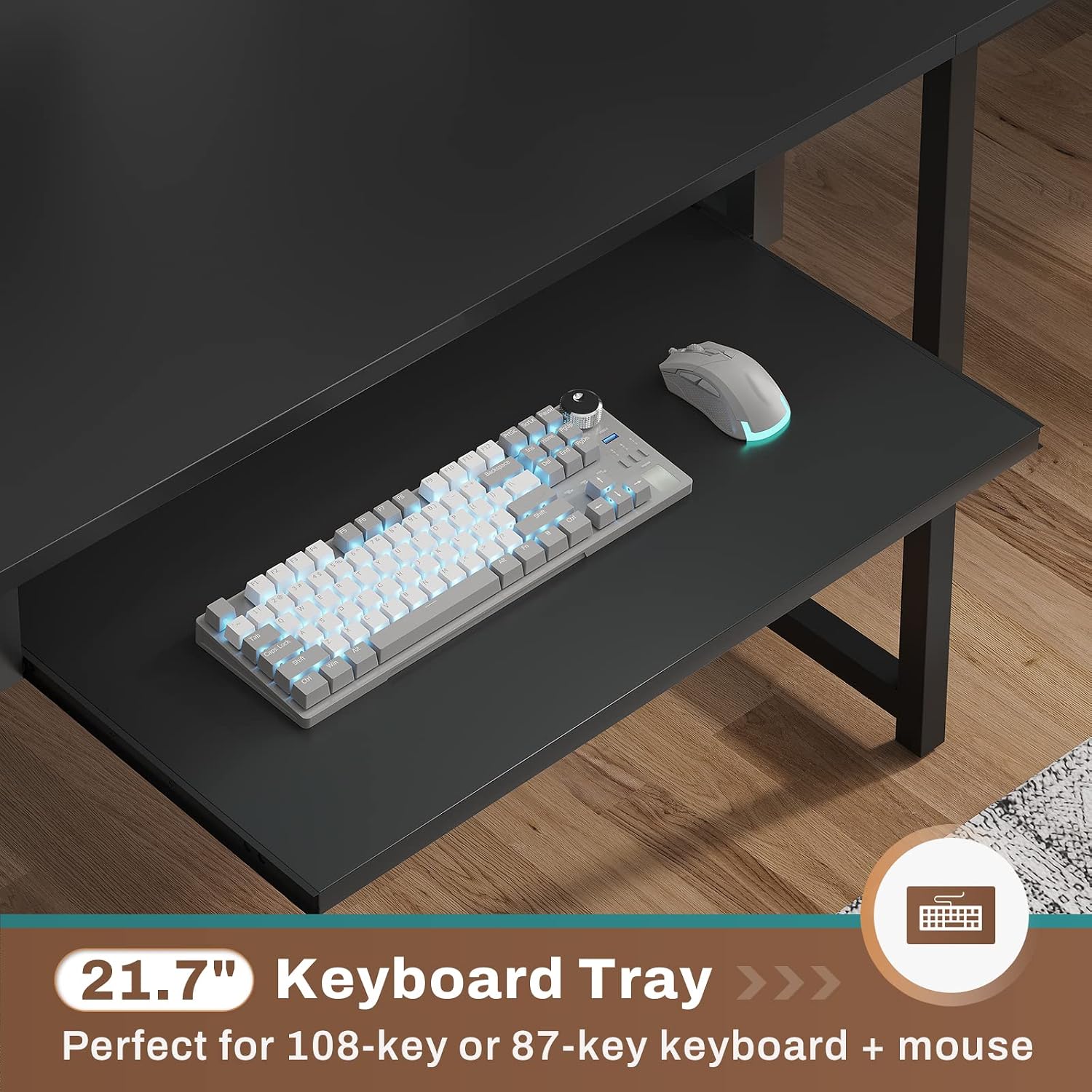 A close-up of the pull-out keyboard tray with a keyboard and mouse placed on it.