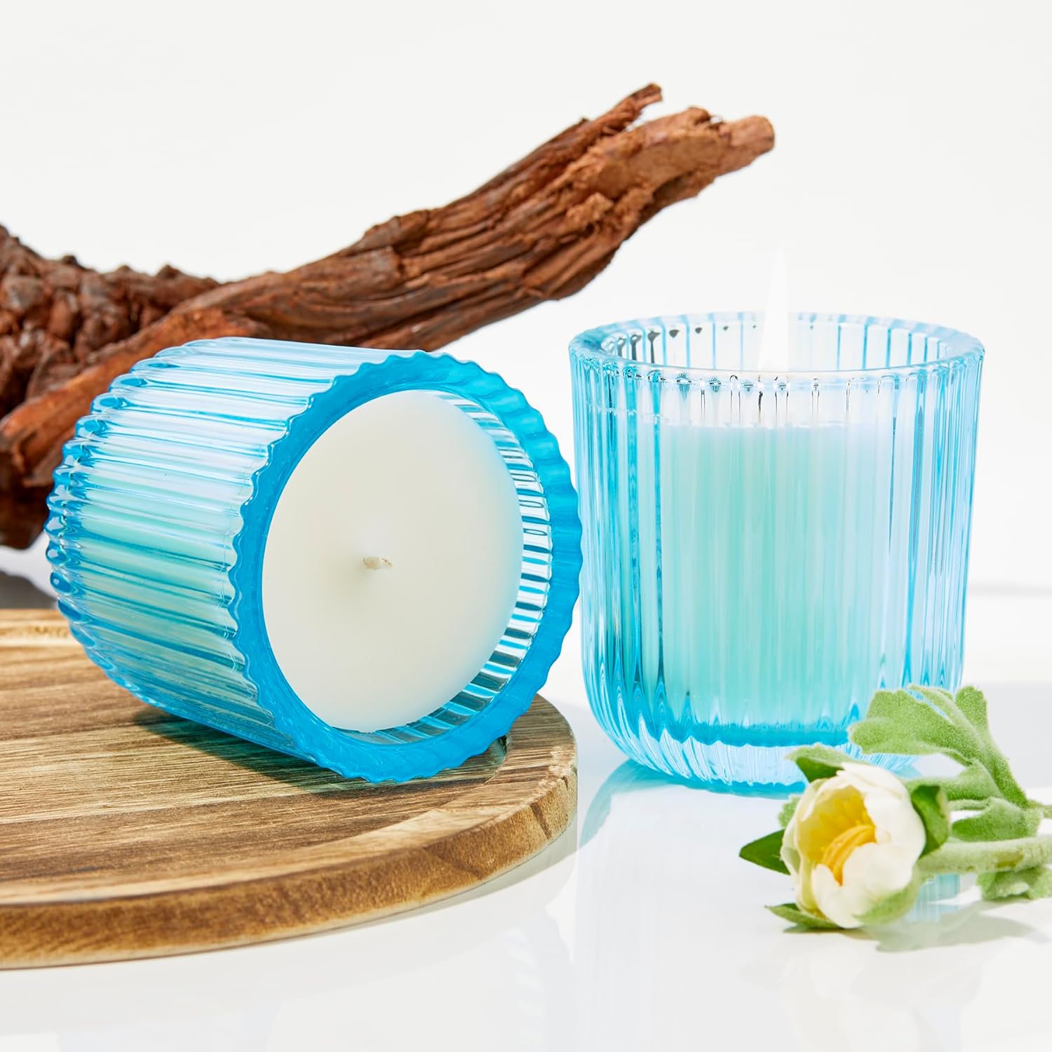 Field + Fleur by Hillhouse Naturals Sea Salt Blue 8oz Glass Scented Candle. with scents of California Lemon, Water Lily, White Jasmine, Driftwood, Rosewater.100% Soy Wax Blend. Burn time 50+ Hours.