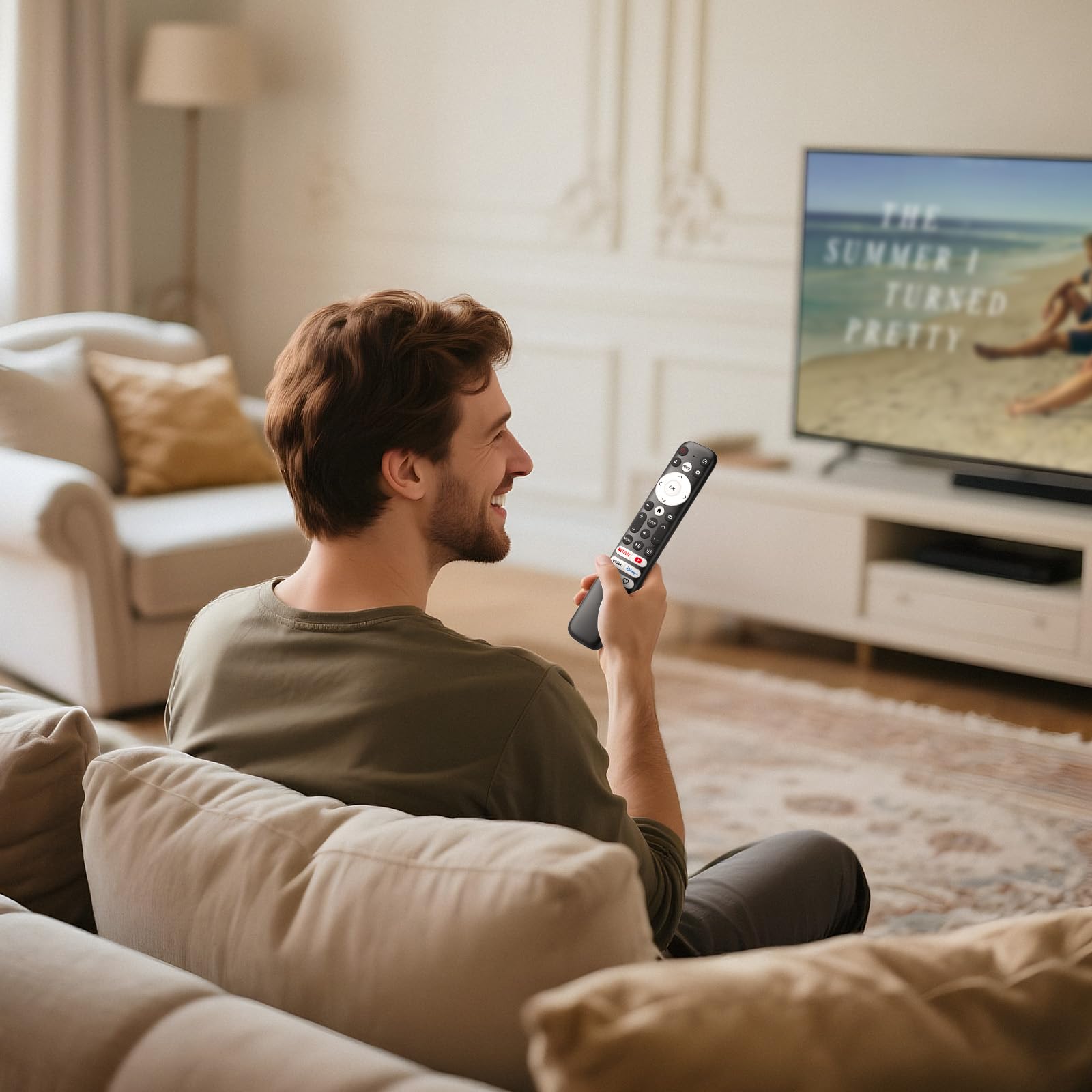 Person relaxing on a sofa using one universal remote while watching TV