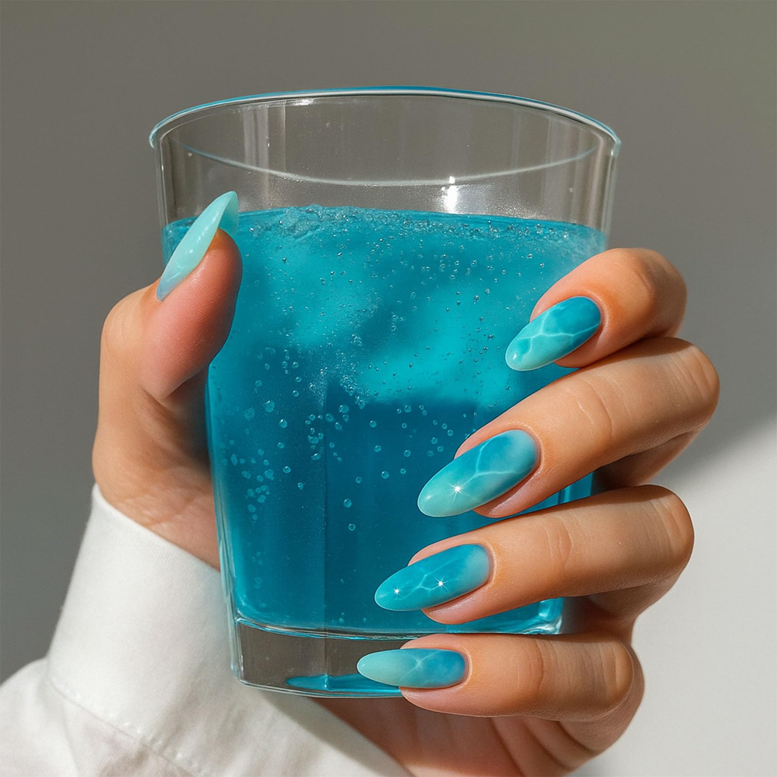 Gradient Turquoise Marbled Wave Press On Nails With Sparkling Star Accents Almond Shaped - Image 2