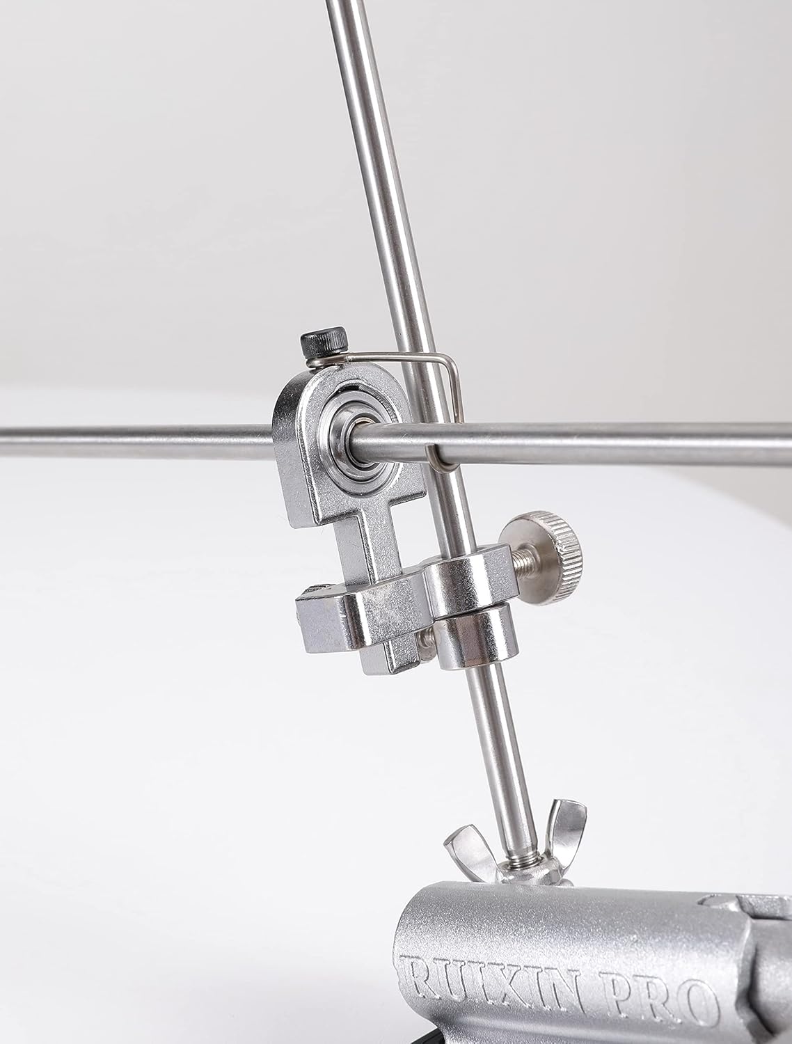 ക്ലോസ് അപ്പ് view of the angle adjustment mechanism on the RUIXIN PRO RX-009 Knife Sharpener, showing the knob and vertical rod.