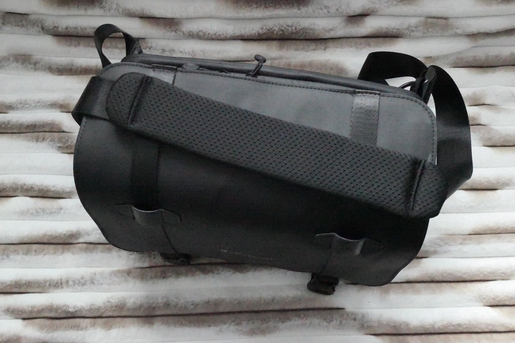 Decent mid-sized photographer's sling bag, good size to capacity ratio, quality materials