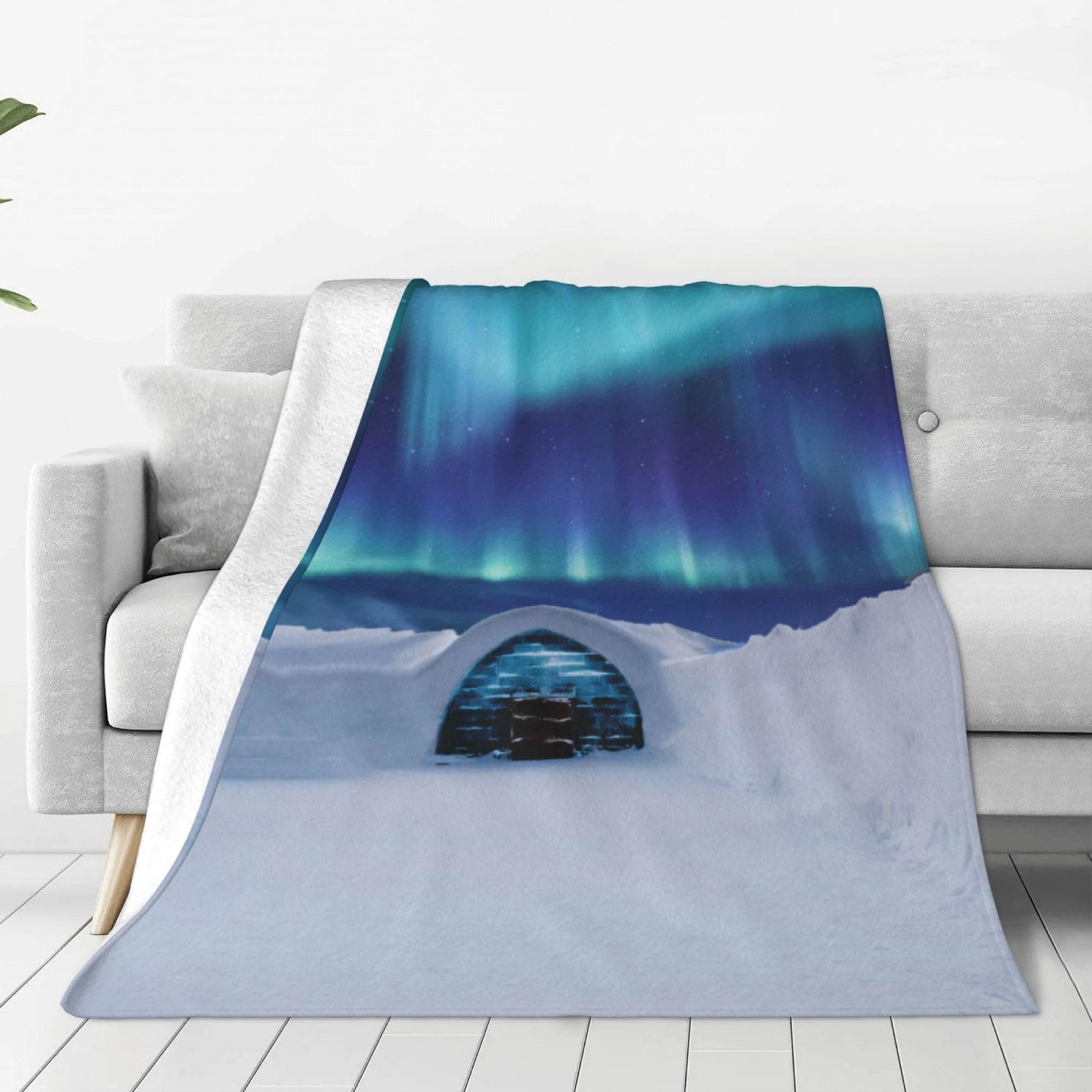 Couverture polaire aurore du Nord douce pour vos soirées cocooning sur le canapé
