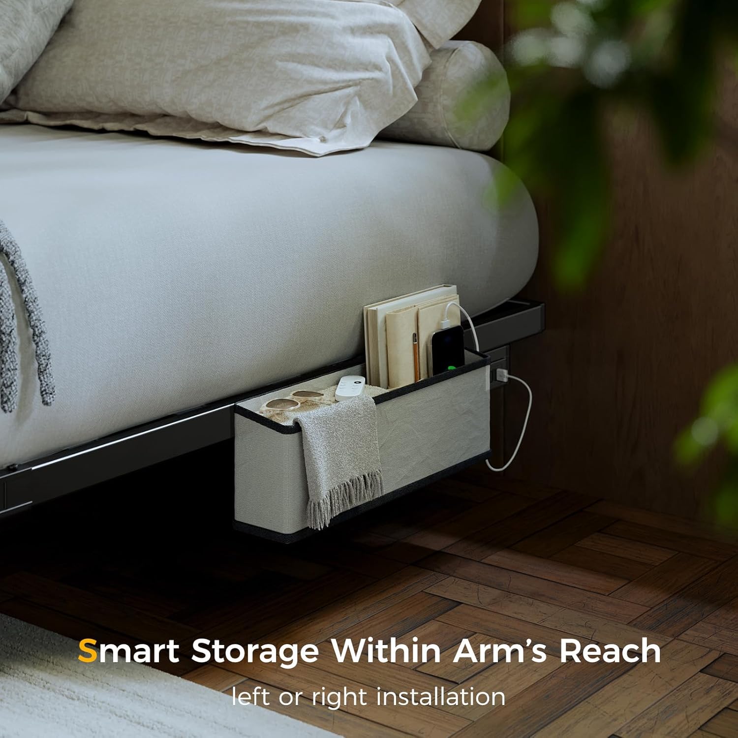 A bedside caddy attached to the Tatub Floating Bed Frame, holding books, a remote, and other small items.