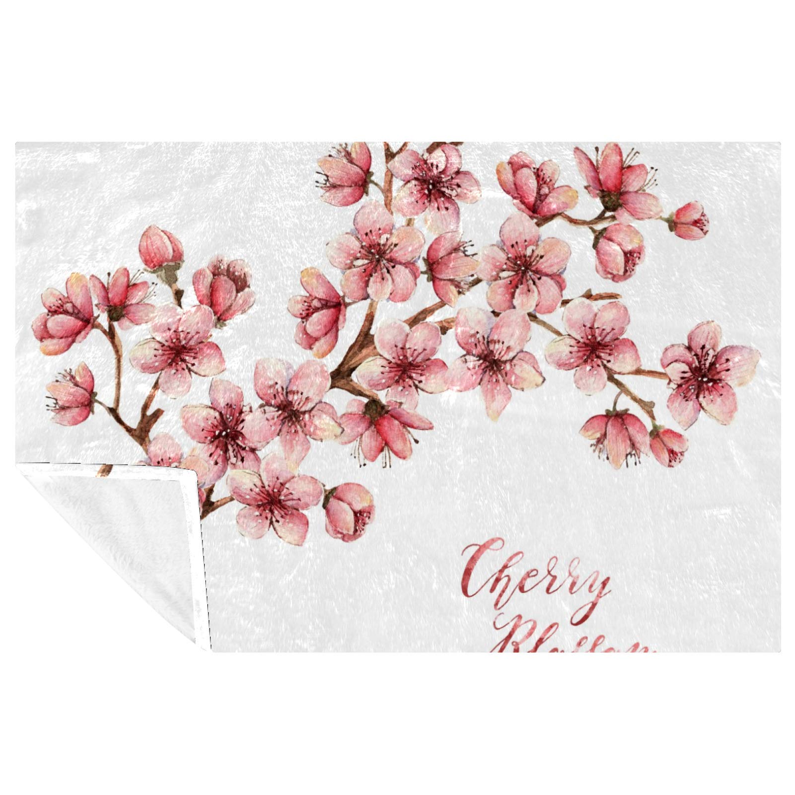 Couverture fleurs de cerisier douce et chaude pour des moments cocooning uniques