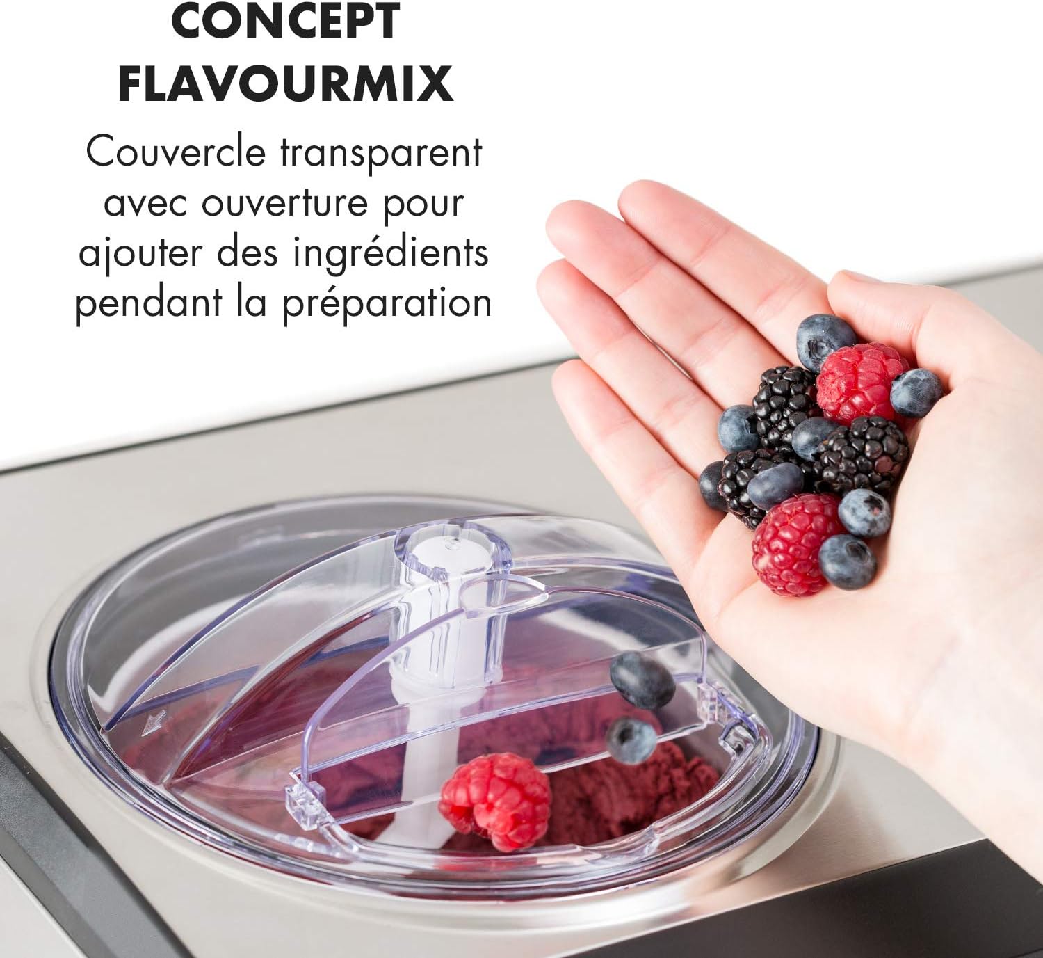 Hand adding ingredients through the transparent lid of the Klarstein Dolce Bacio Ice Cream Maker