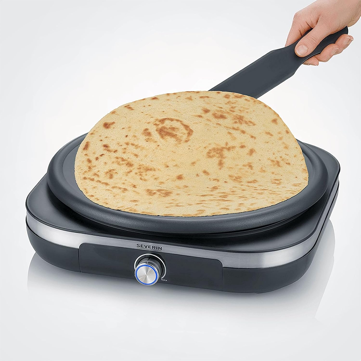 Flipping a crepe on the SEVERIN Crepe Maker