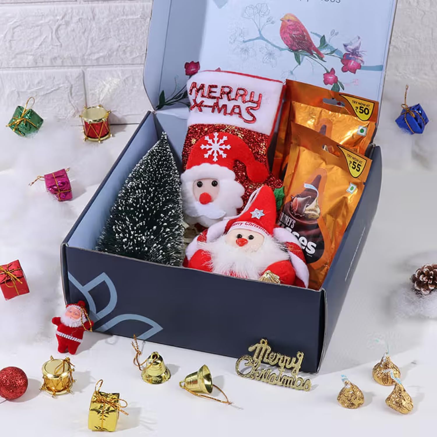 FlowerAura Christmas Secret Santa Gift Hamper of Christmas Tree, Santa Ring, Glitter Sock, Christmas Decor Items, 2 Chocolates | Employee Gifting | Christmas Gift Box For Family, Friends & Colleagues FlowerAura Christmas Secret Santa Gift Hamper of Christmas Tree, Santa Ring, Glitter Sock, Christmas Decor Items, 2 Chocolates | Employee Gifting | Christmas Gift Box For Family, Friends & Colleagues