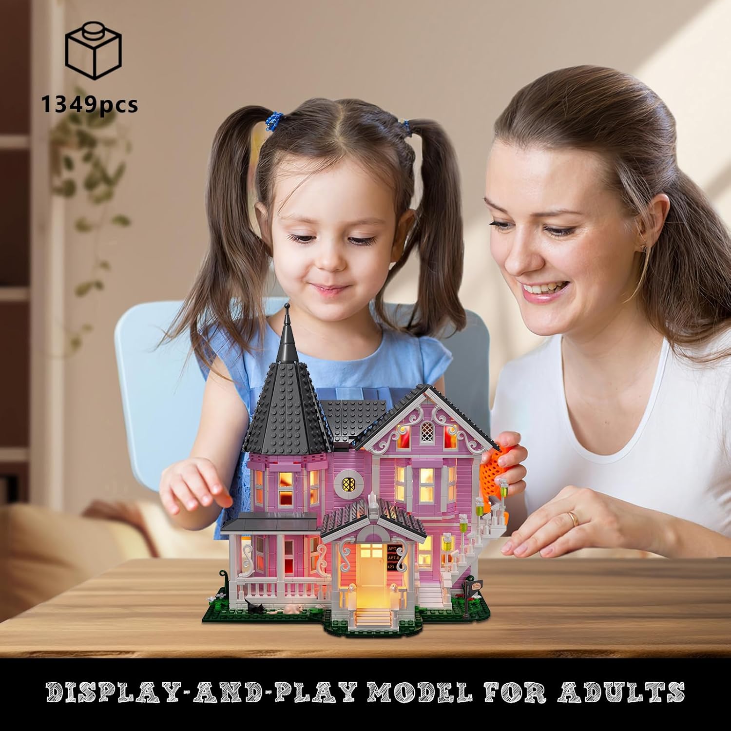 Adult and child assembling the VONADO Pink Palace House Building Set.