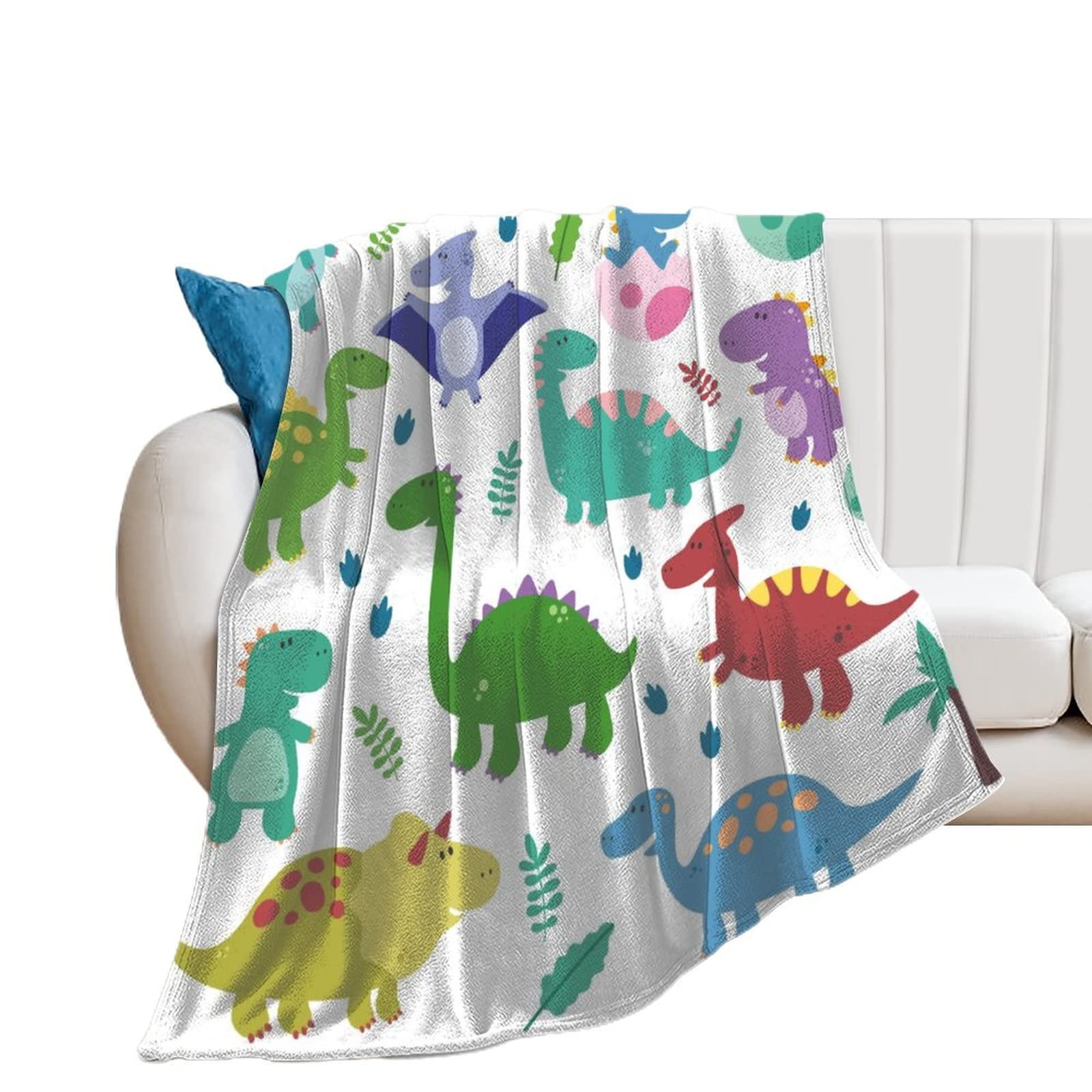 Couverture polaire dinosaures colorés pour réchauffer vos soirées sur le canapé