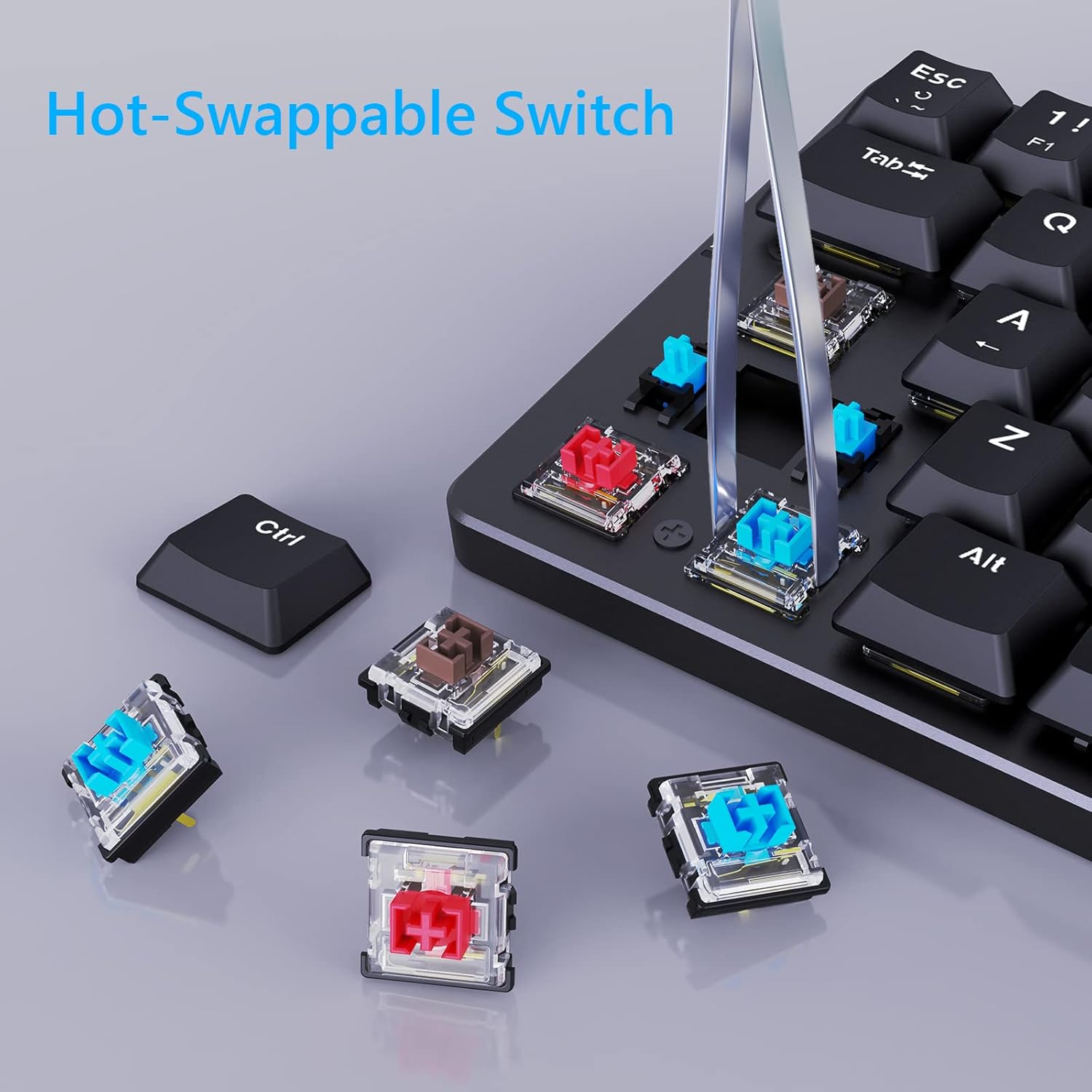 Close-up image showing a keycap and switch being removed from the Redragon K615-R keyboard using a switch puller, with several loose switches nearby.