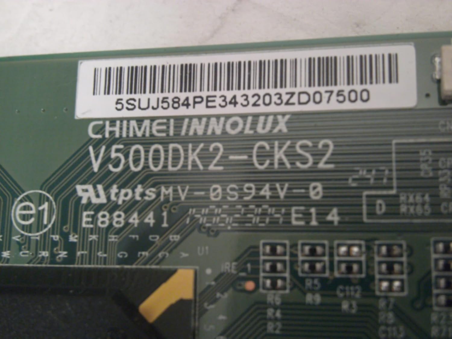 Close-up of T-CON board label showing V500DK2-CKS2 and E88441