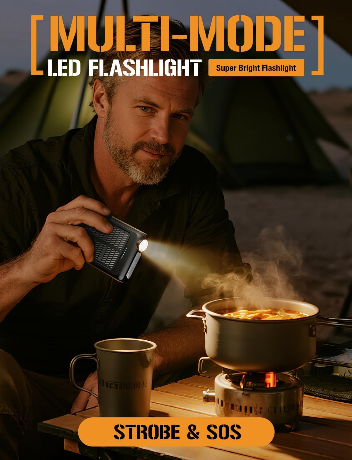 Man using the ToughTested ROC 5 Power Bank's flashlight feature while campعمل.