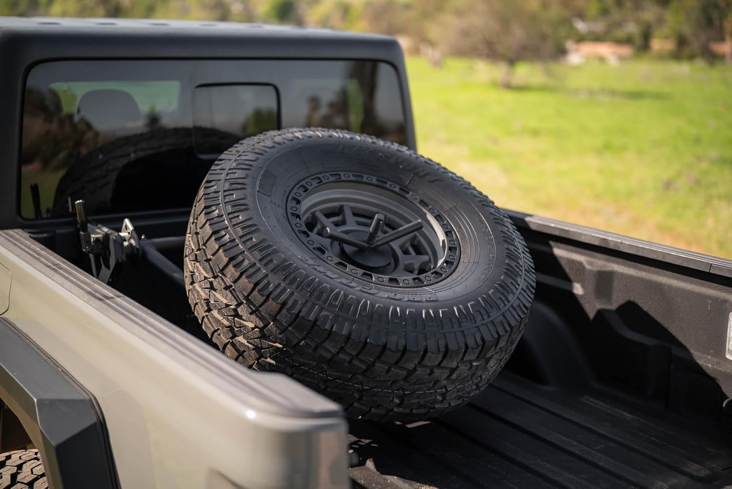 DV8 Offroad Adjustable in-Bed Spare Tire Carrier for 2020-2025 Jeep Gladiator JT | Flat or Angled Mounting Positions | Stainless Single Action Latching Mechanism | Compatible w/Most Wheel/Tire Setups