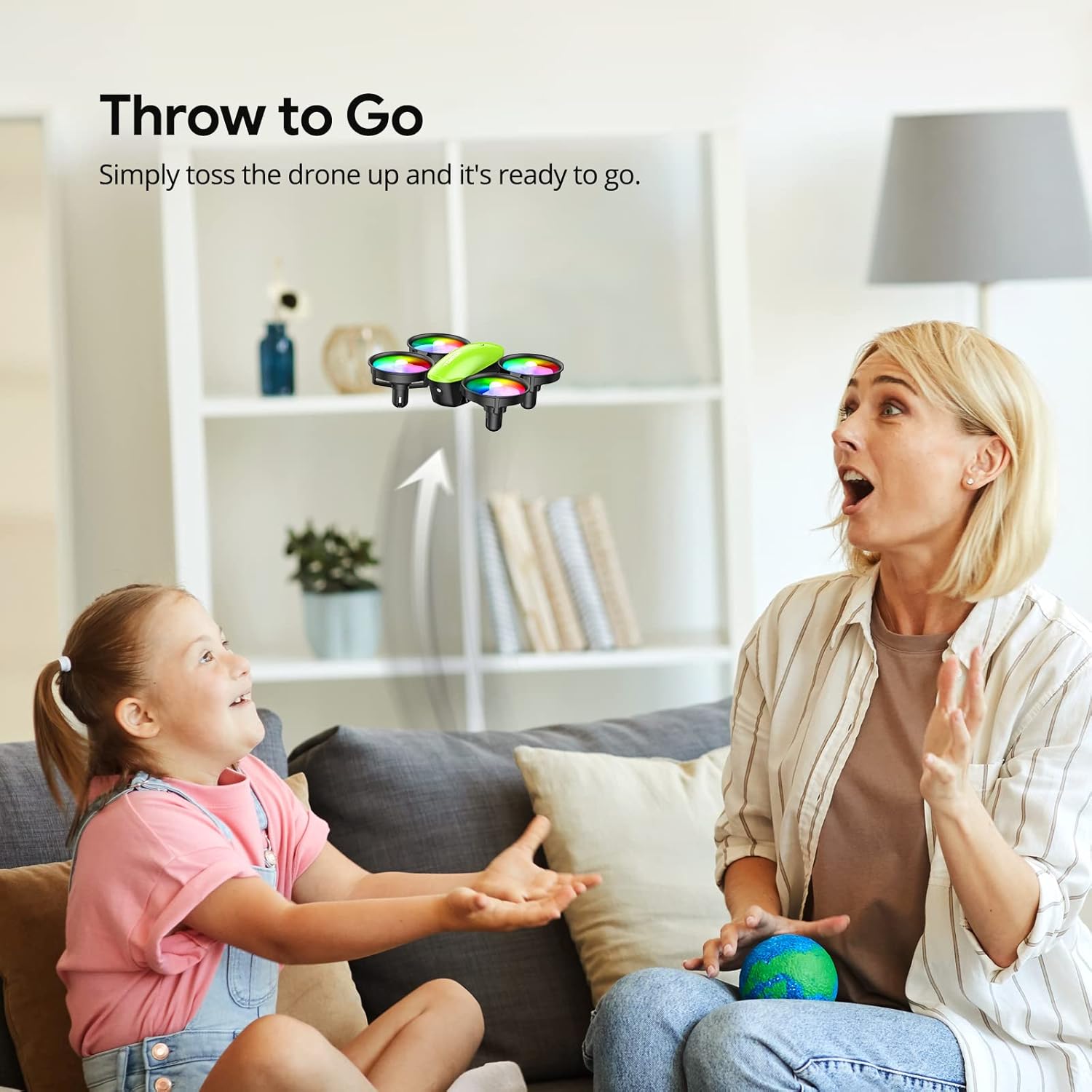 A child tossing the TOMZON A23 Mini Drone into the air to start flying.