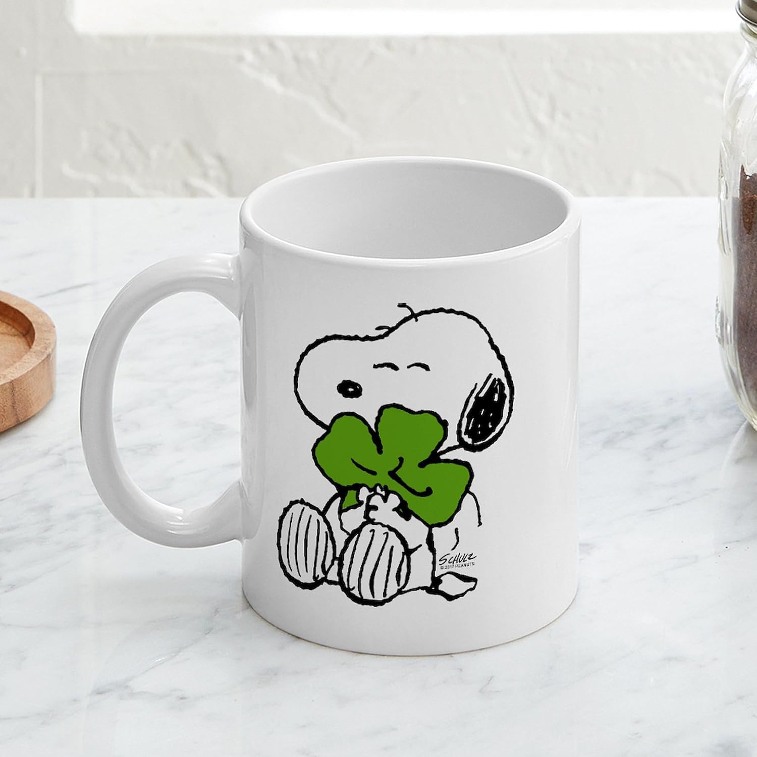 CafePress Snoopy Hugging Clover 11 Oz Ceramic Mug 11 oz (325 ml) Ceramic Coffee Mug